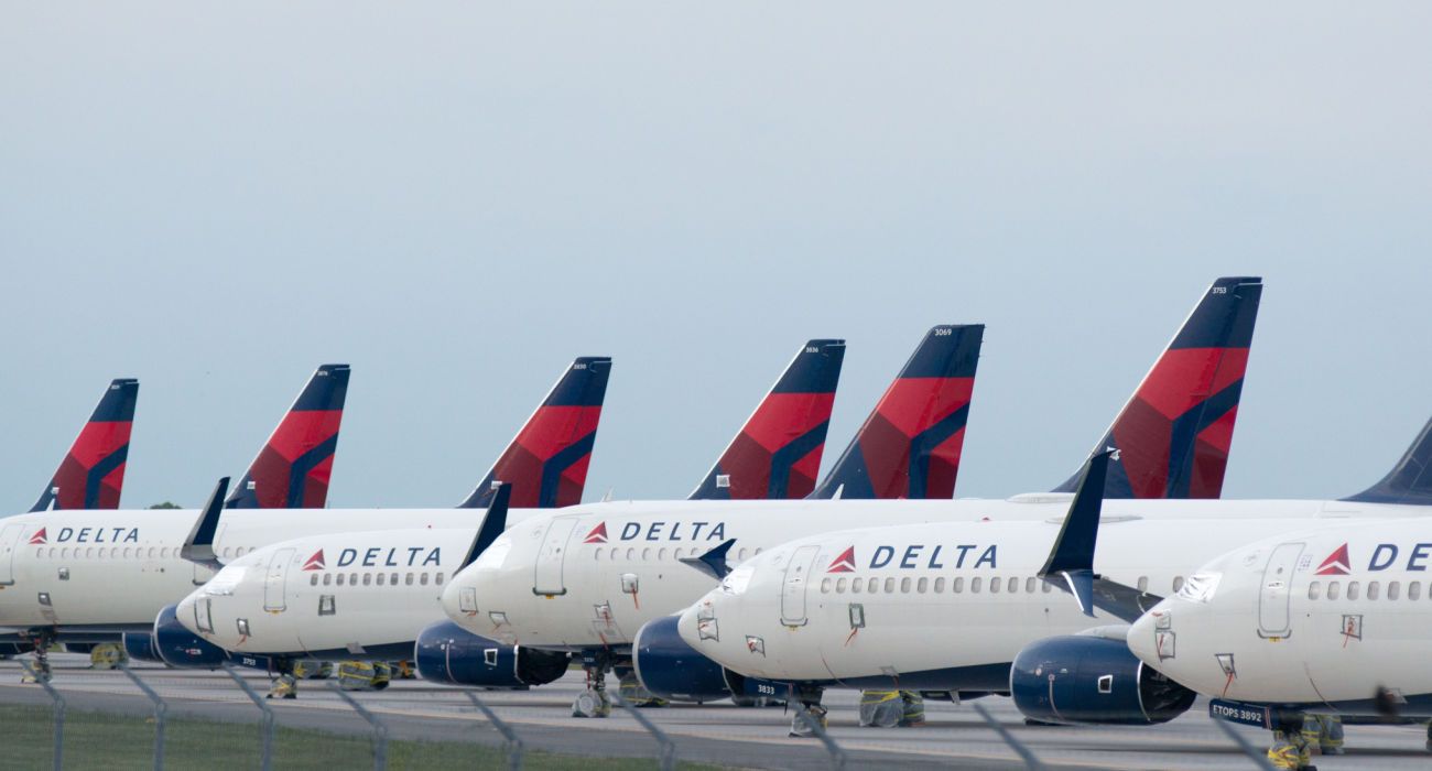 Delta Airplanes sit in a row at Kansas City International Airport
