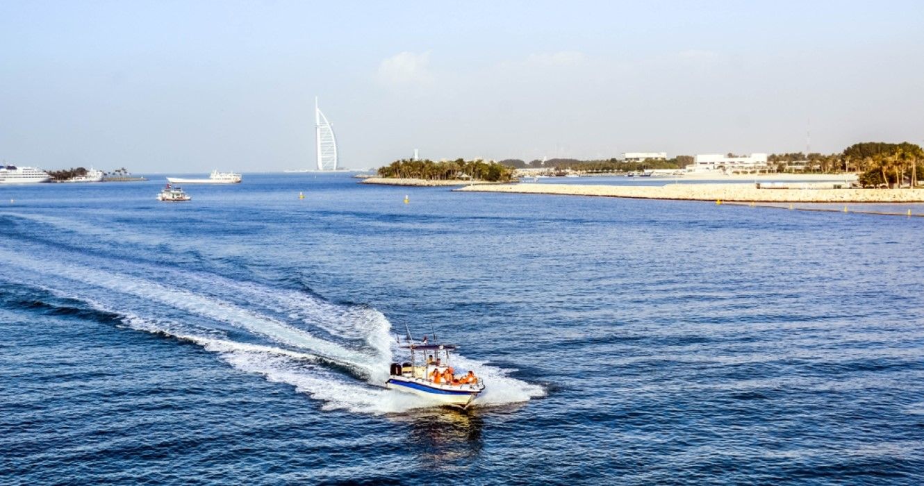 Scenic view of Burj Al Arab with yachts in the sea, Dubai
