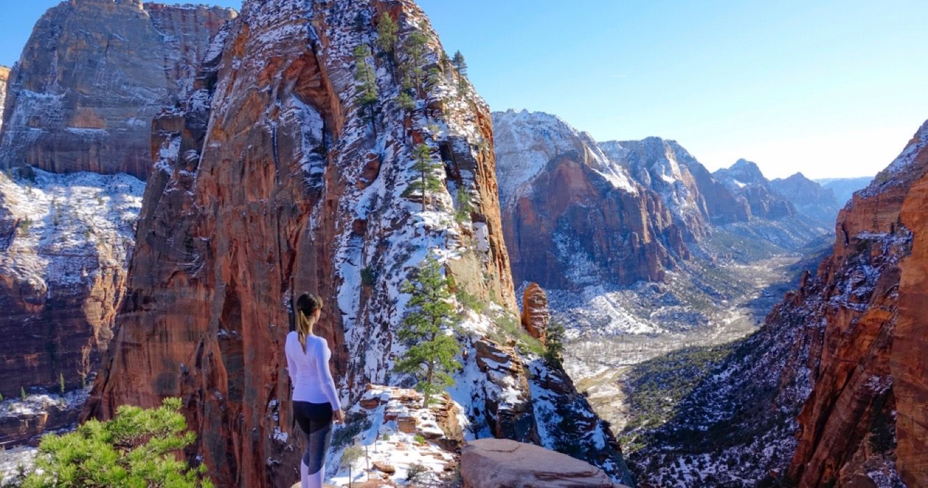 Woman hiking Zion National Park in winter