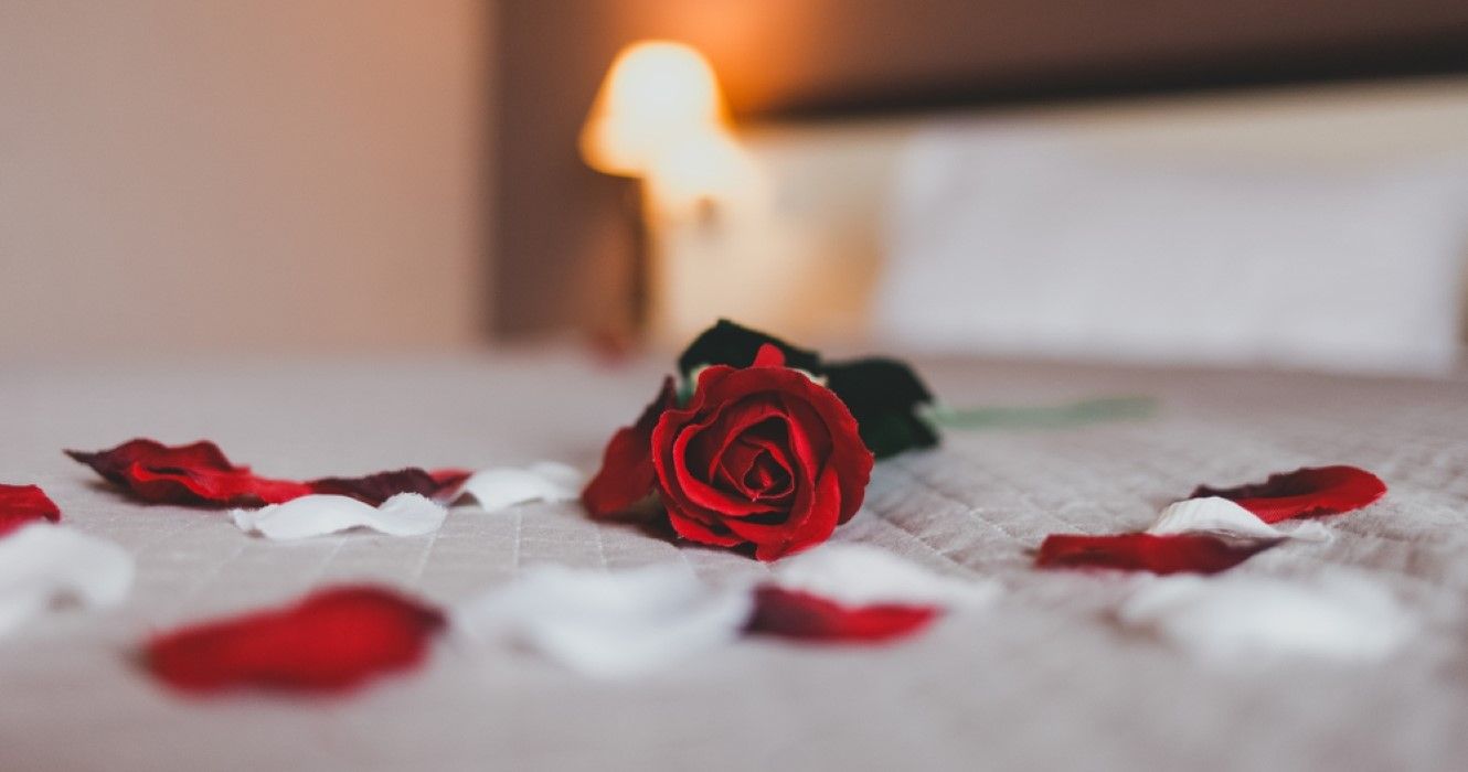 Rose on the bed in the hotel rooms
