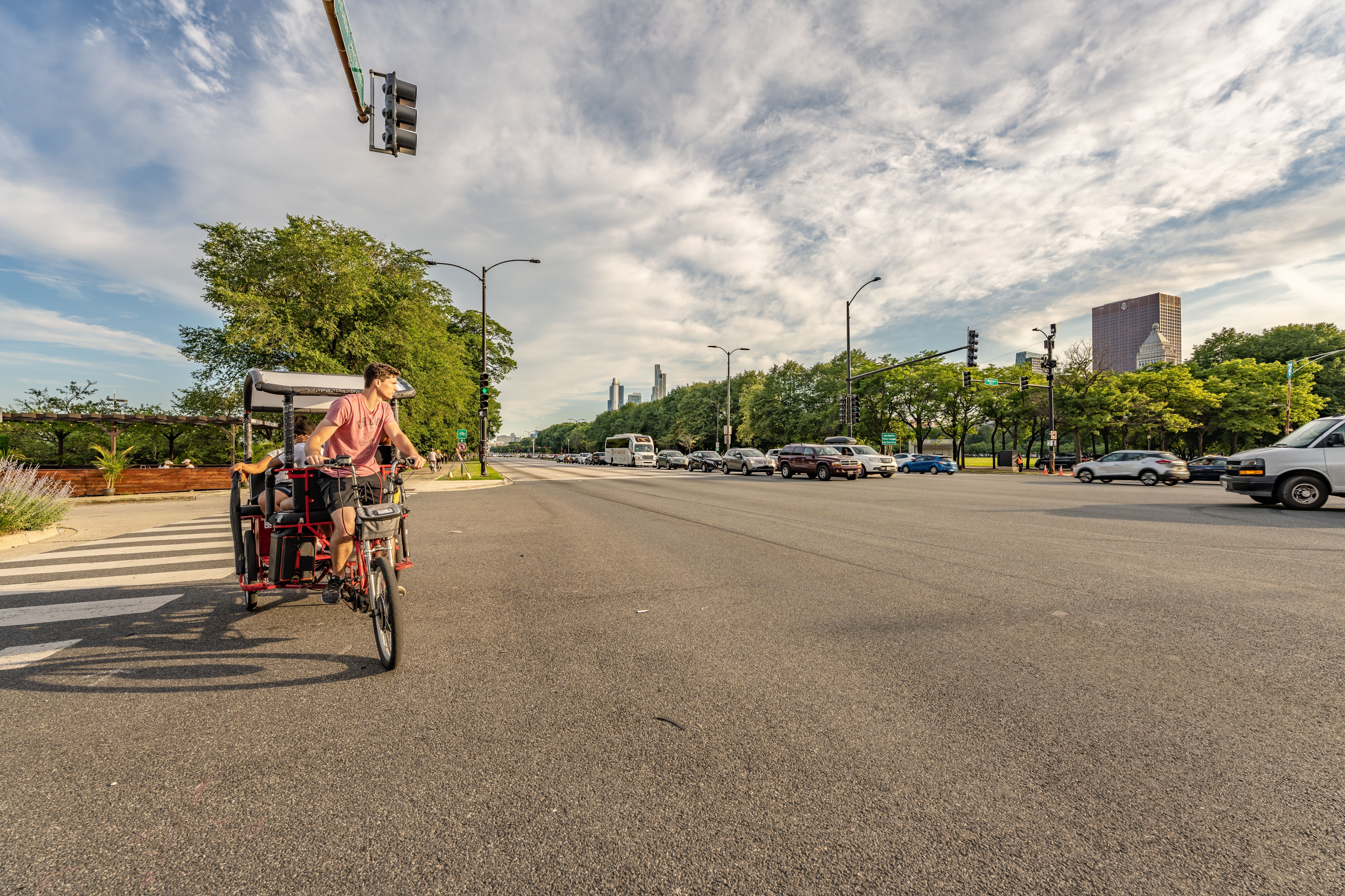 A pedicab driver carrying tourists