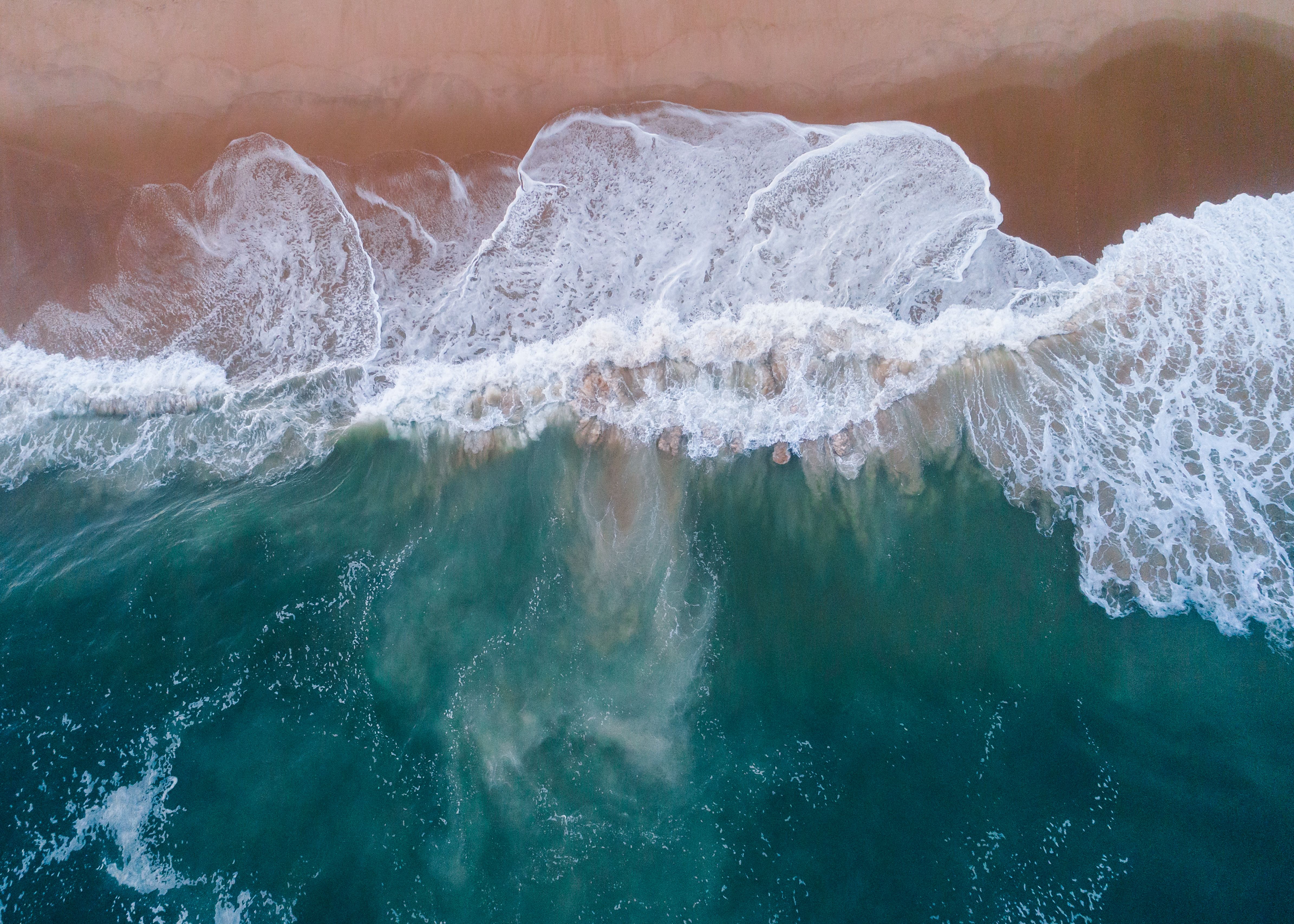 Large Waves Crashing Against a Beach in East Hampton, New York