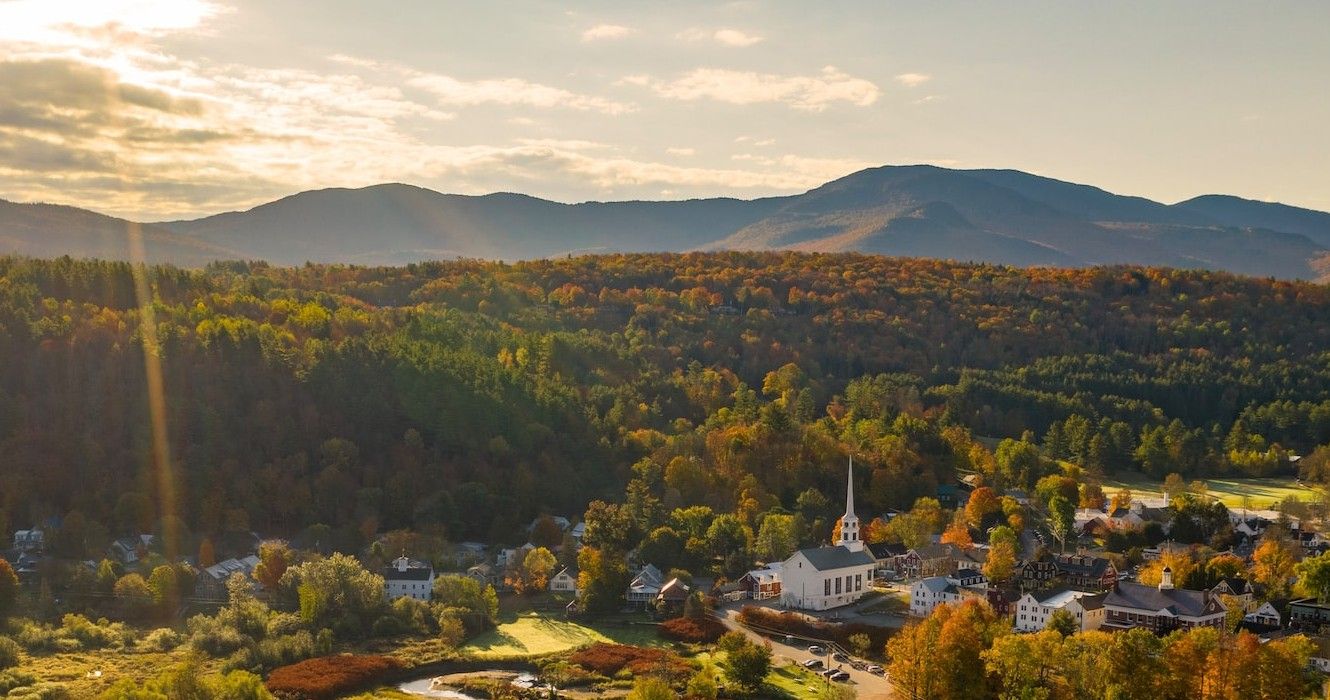 A view of the sun shining on the town of Stowe, Vermont