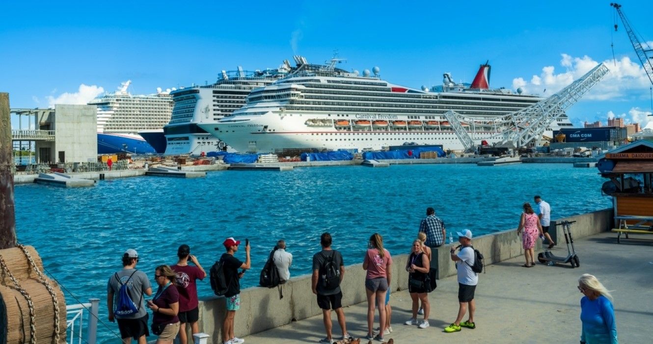 Tourists looking at cruise ships in Nassau, Bahamas