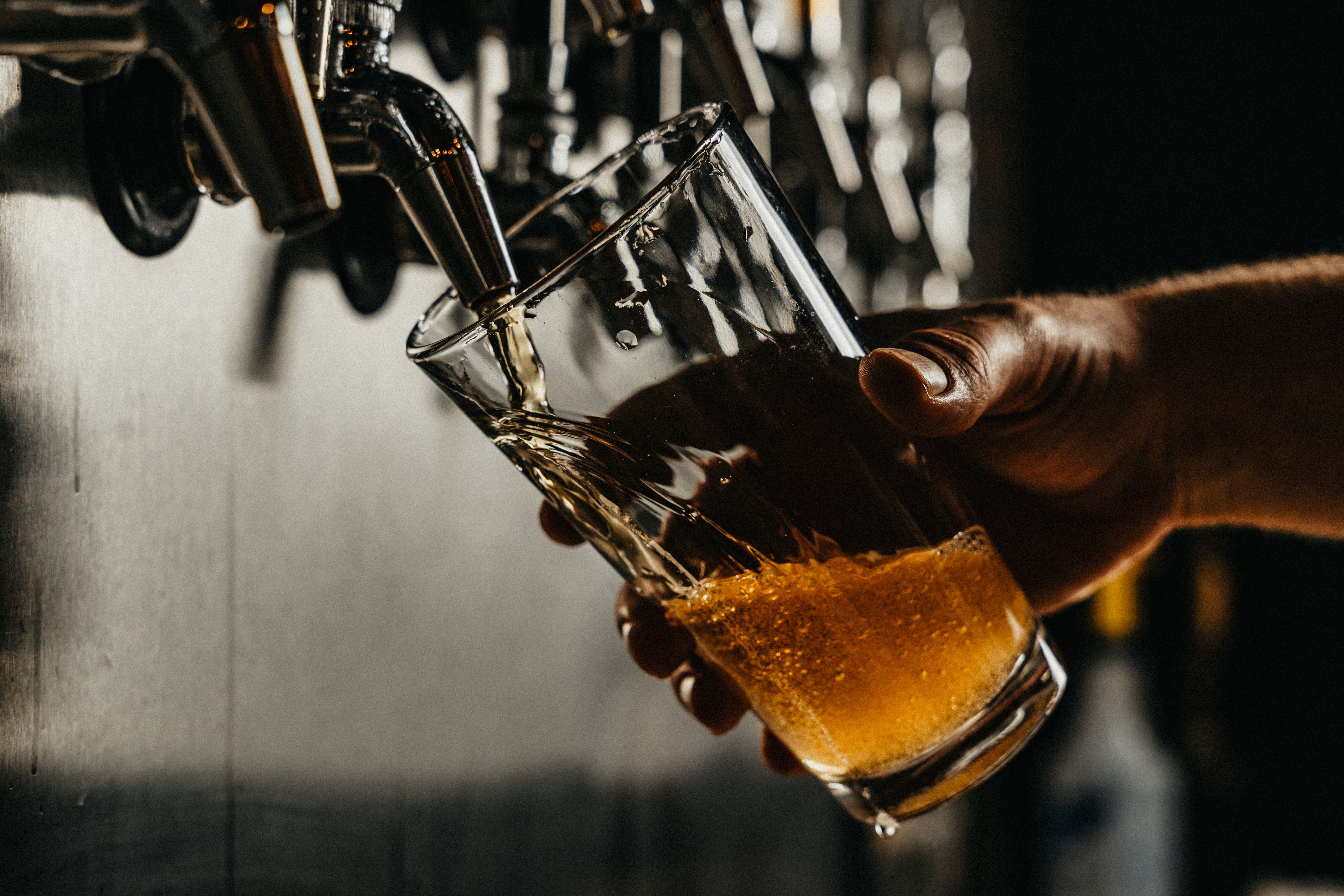 Beer Being Poured From The Tap