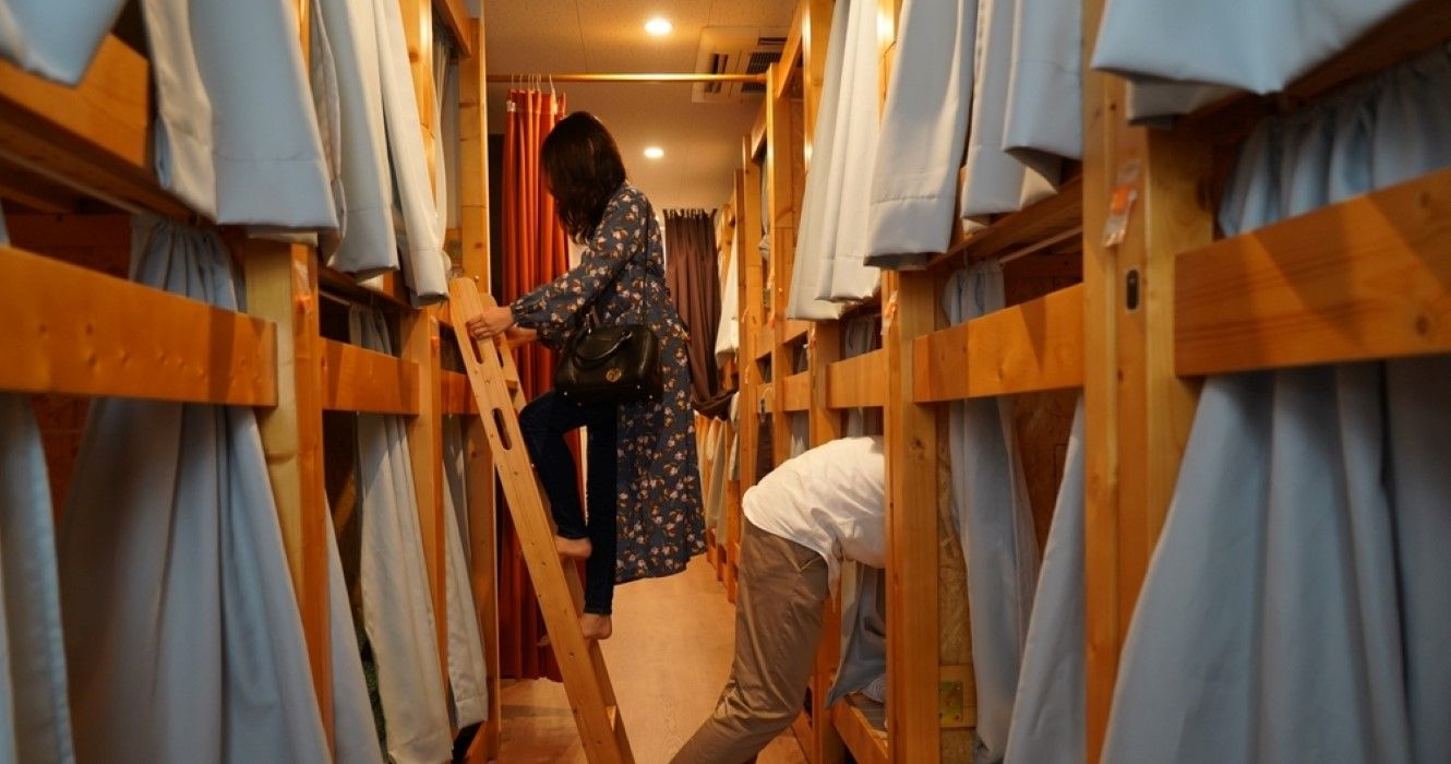 People in their room in a hostel in Japan