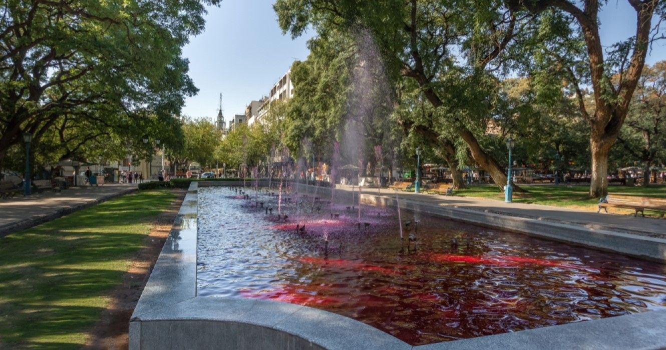 Plaza Independencia (Independence Square) fountain with red water like wine in Mendoza, Argentina