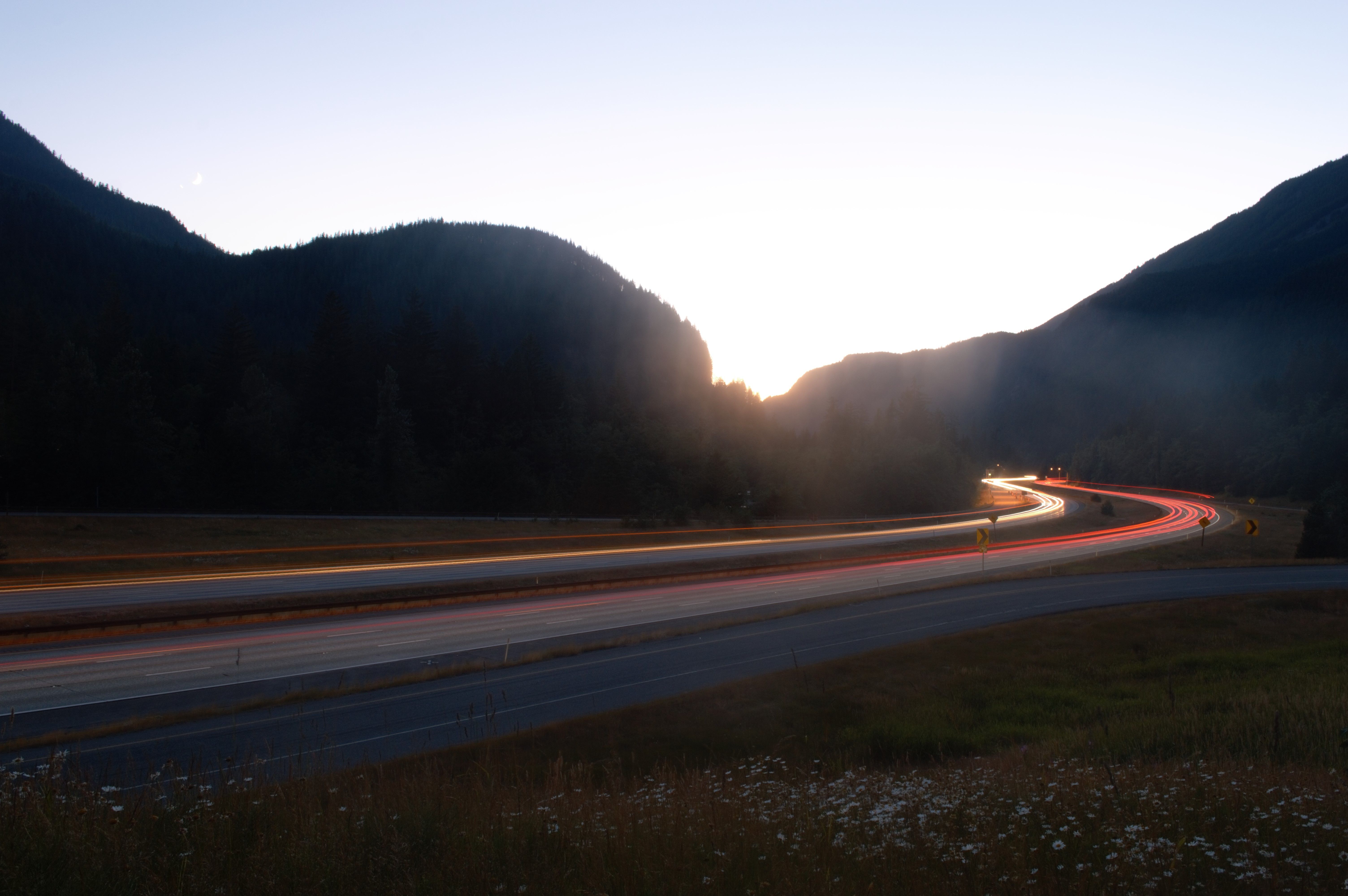 Freeway of snoqualmie pass lighting up during the most spectacular night where venus is next to the moon