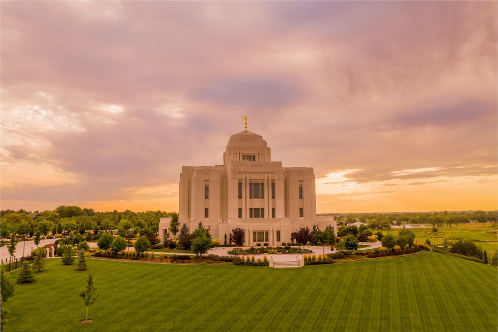 Meridian Idaho Temple lit by a dramatic sunset