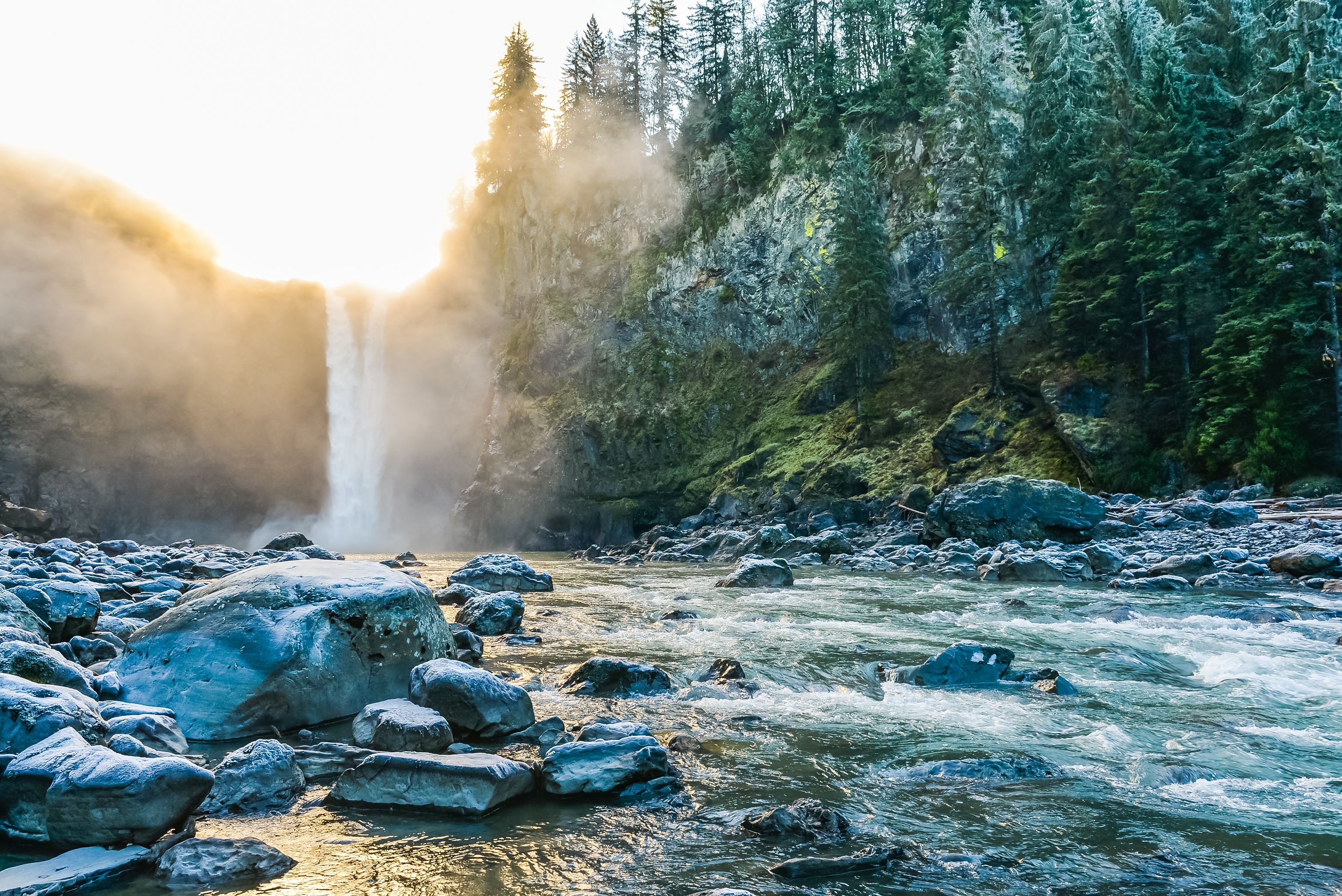 scenic view of Snoqualmie falls with golden fog when sunrise in winter season,Washington,USA