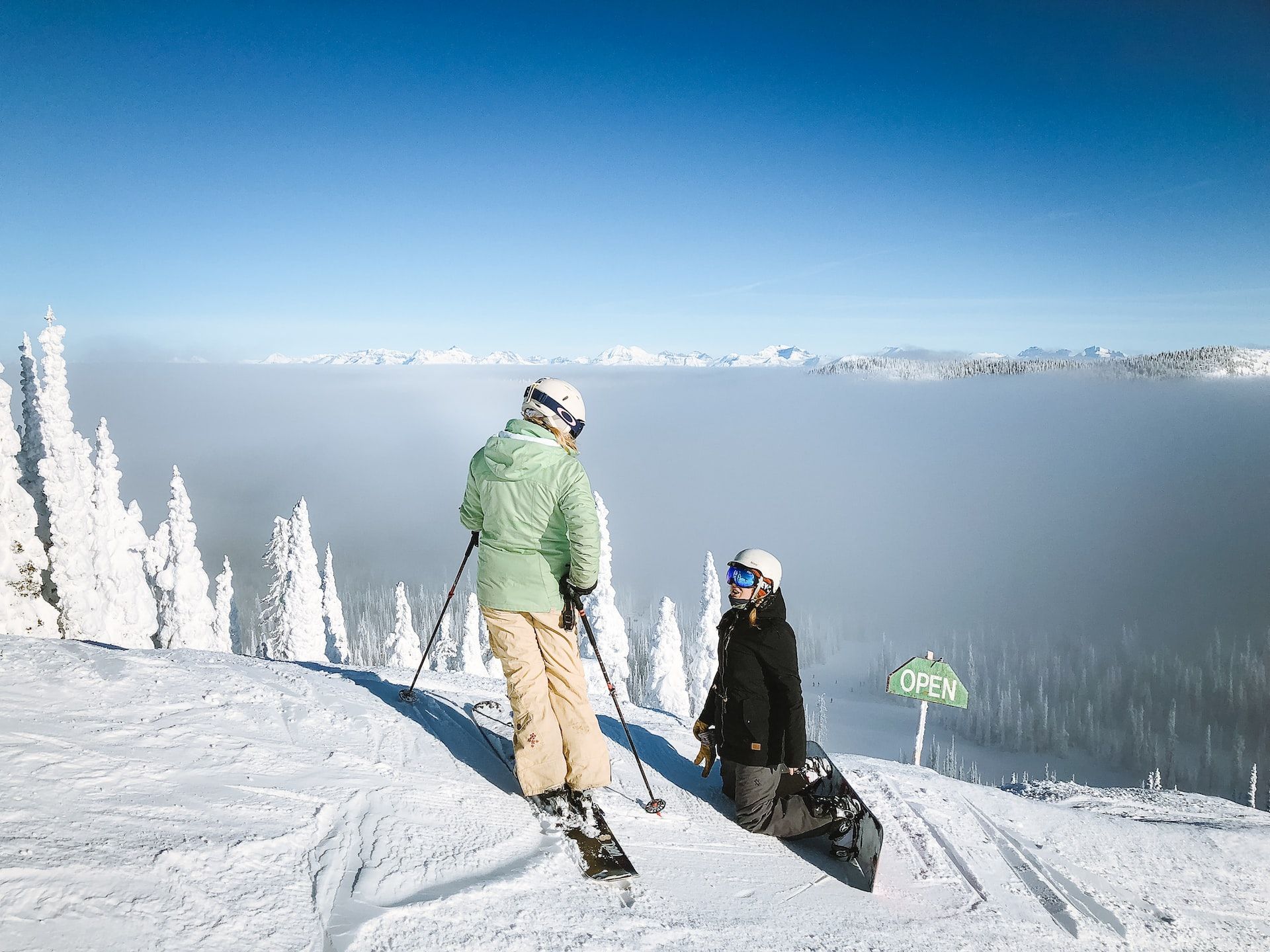 Two people skiing on a mountain in Montana