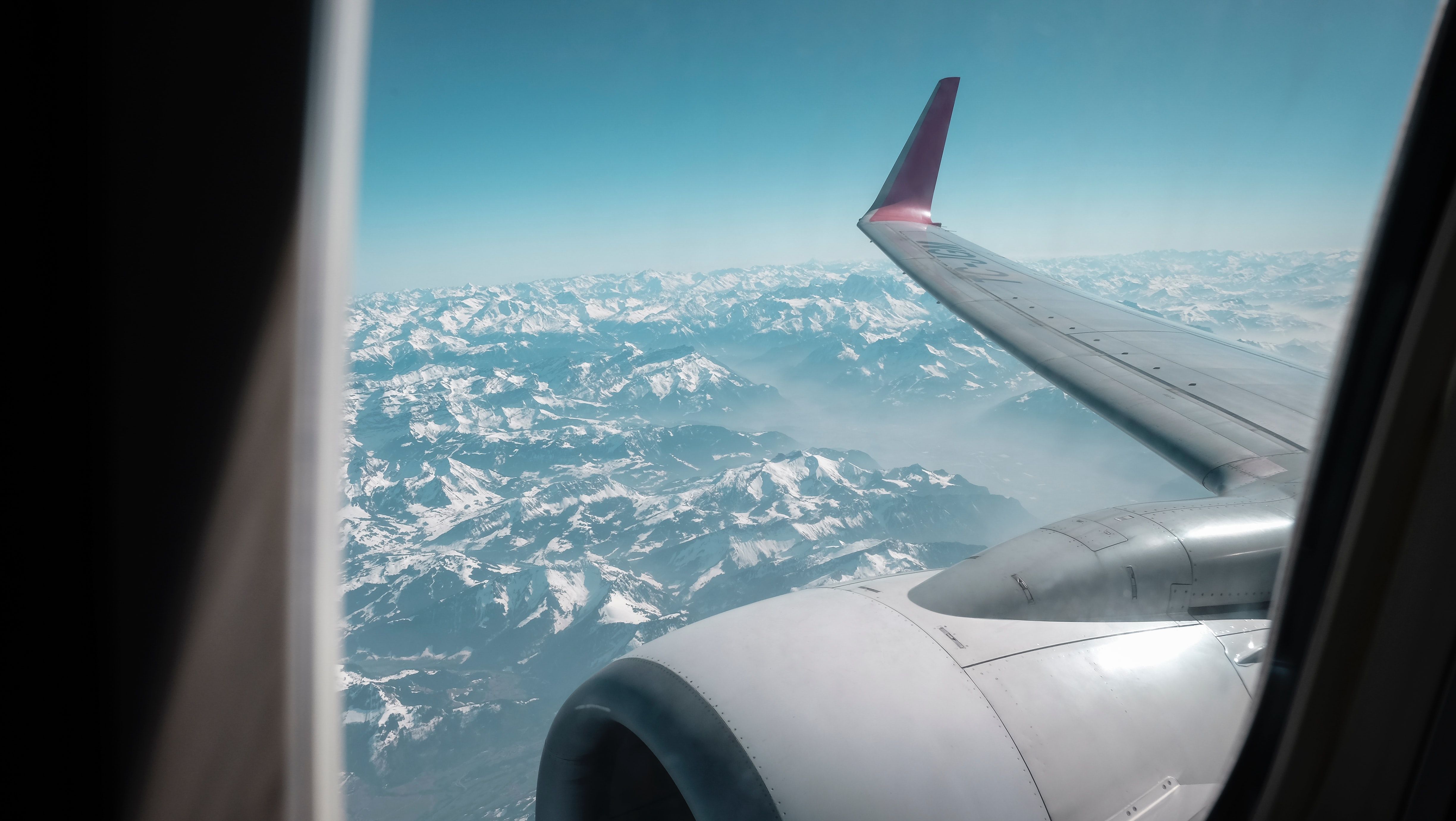 A view of the mountains in the Alps, Switzerland from a window of a plane