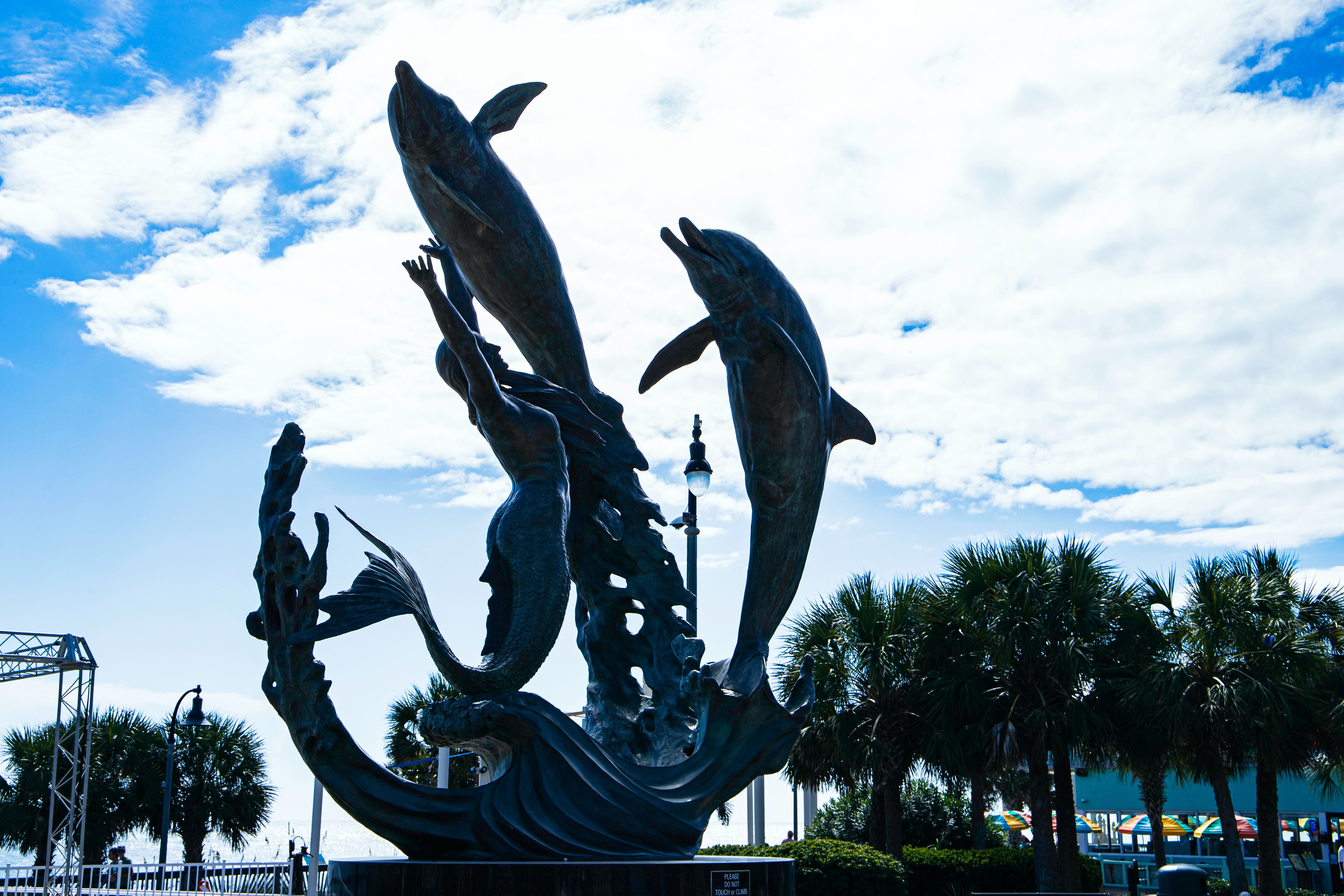 Dolphin and mermaid statue