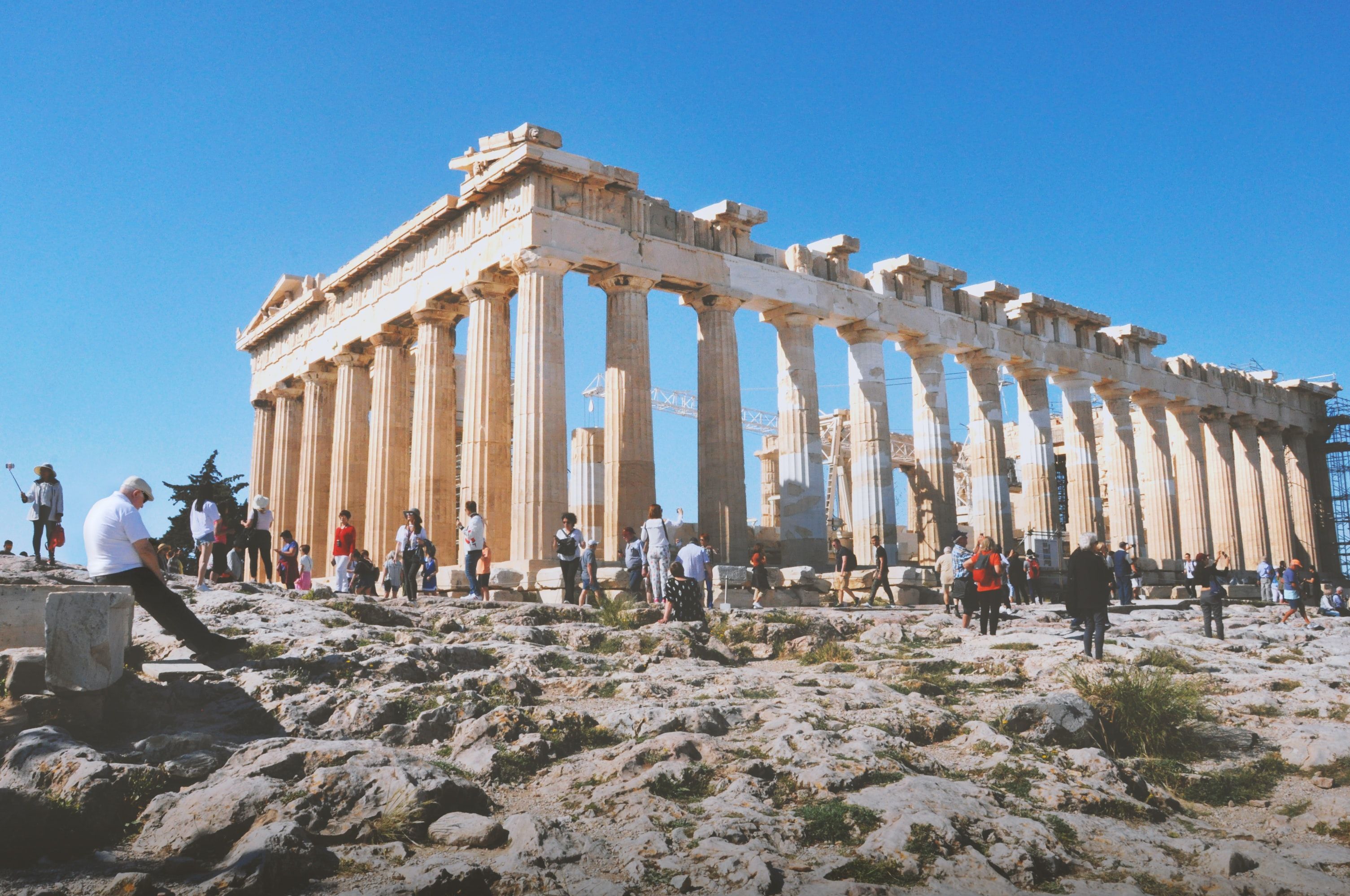 The temple of Acropolis in Athens, Greece, surrounded by tourists