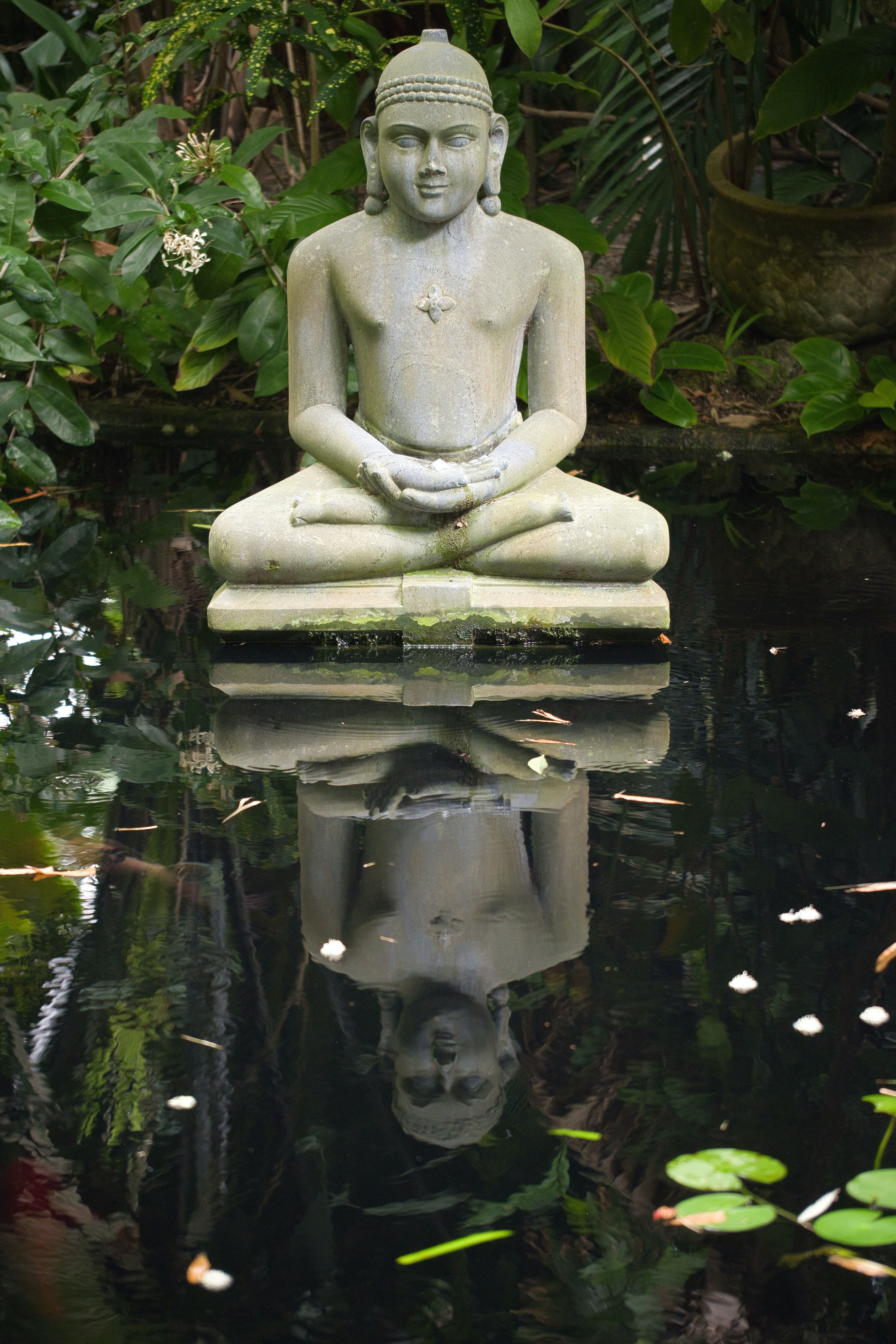 Stone Buddha statue in Marie Selby Botanical Gardens, Florida 