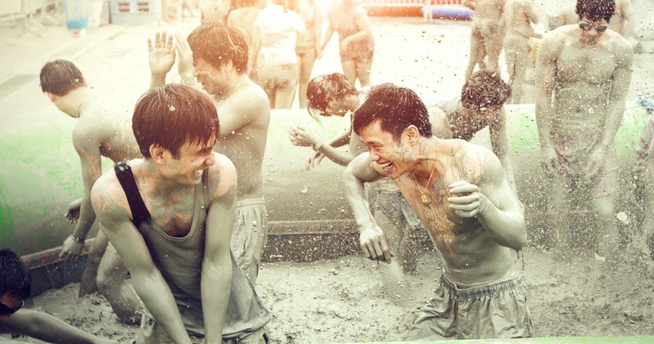 People enjoying Boryeong Mud Festival at Daecheon beach, South Korea