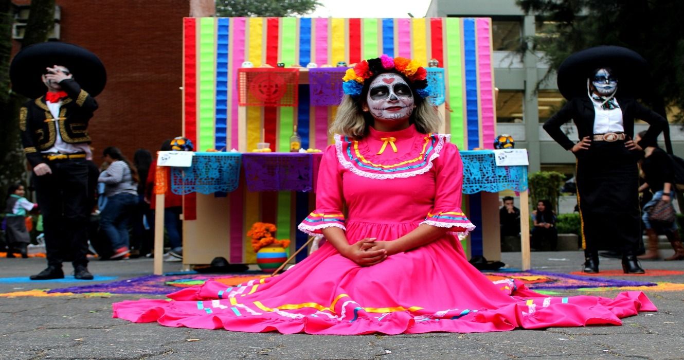 People in costume at the Day of the Dead festival in Mexico