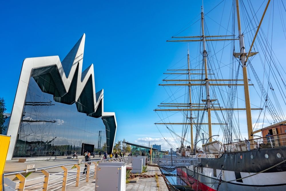 A boat on the river next to the Riverside Museum of Transport and Travel in Glasgow