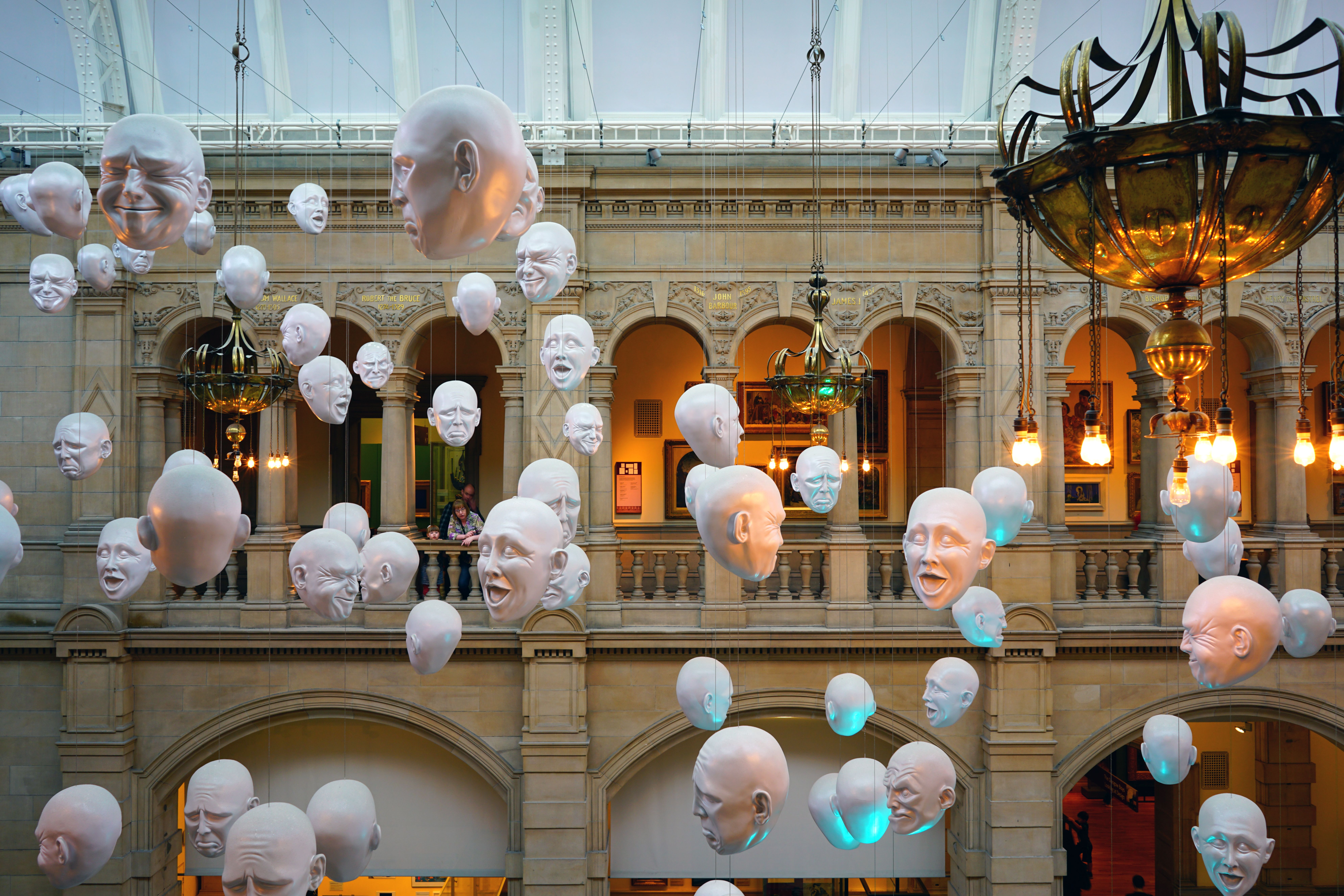 White heads suspended from the ceiling at the Kelvingrove Art Gallery and Museum, Glasgow