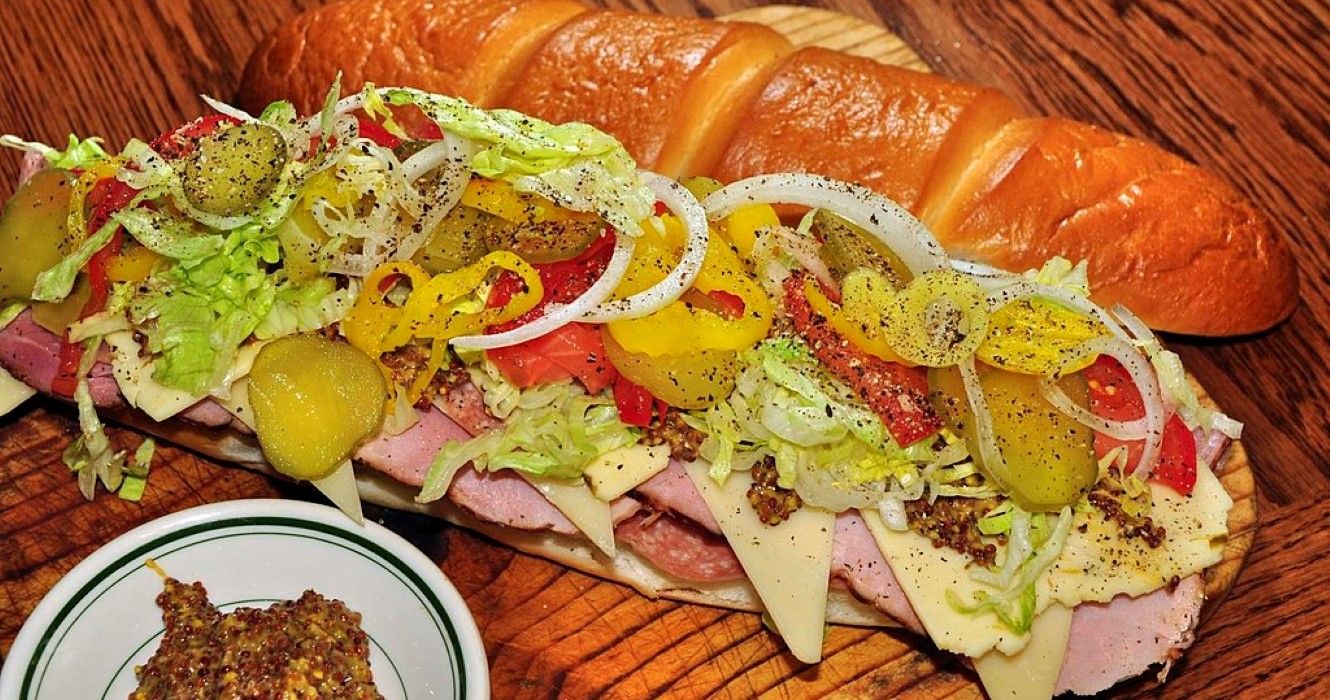 Submarine sandwich with toppings and dijon mustard