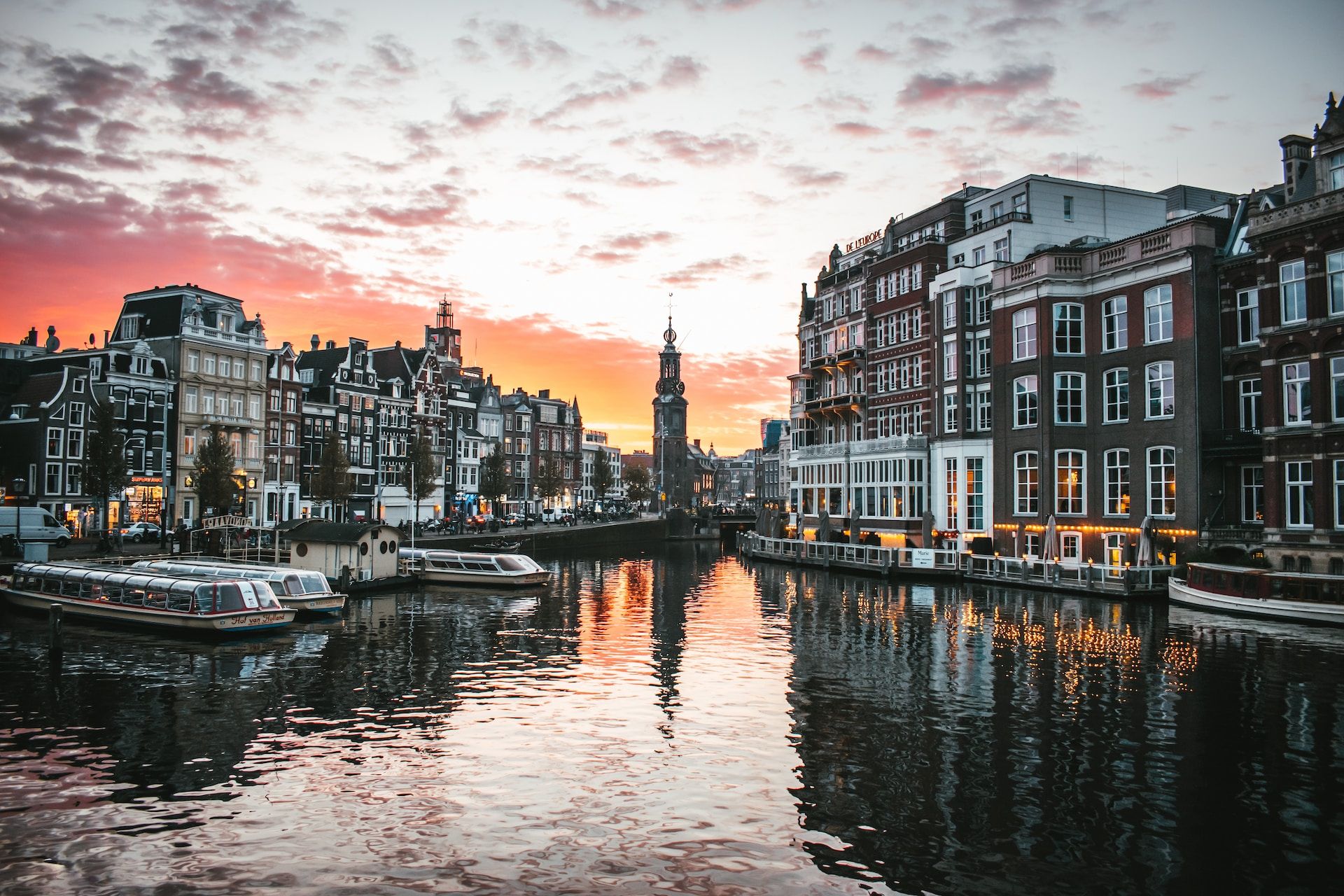 Sunset over the canal and Muntplein in Amsterdam.
