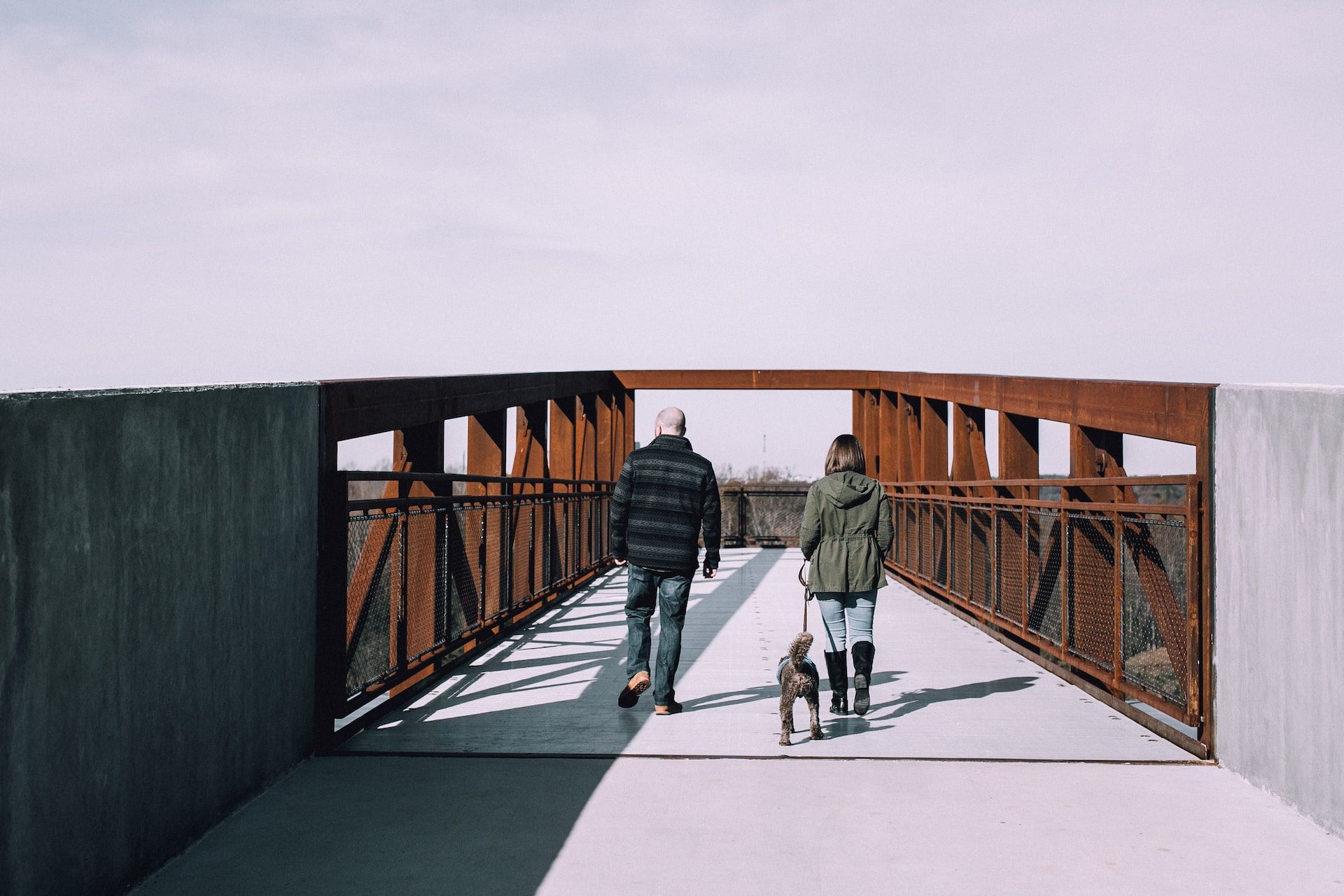 Couple Crossing A Bridge in Winston-Salem