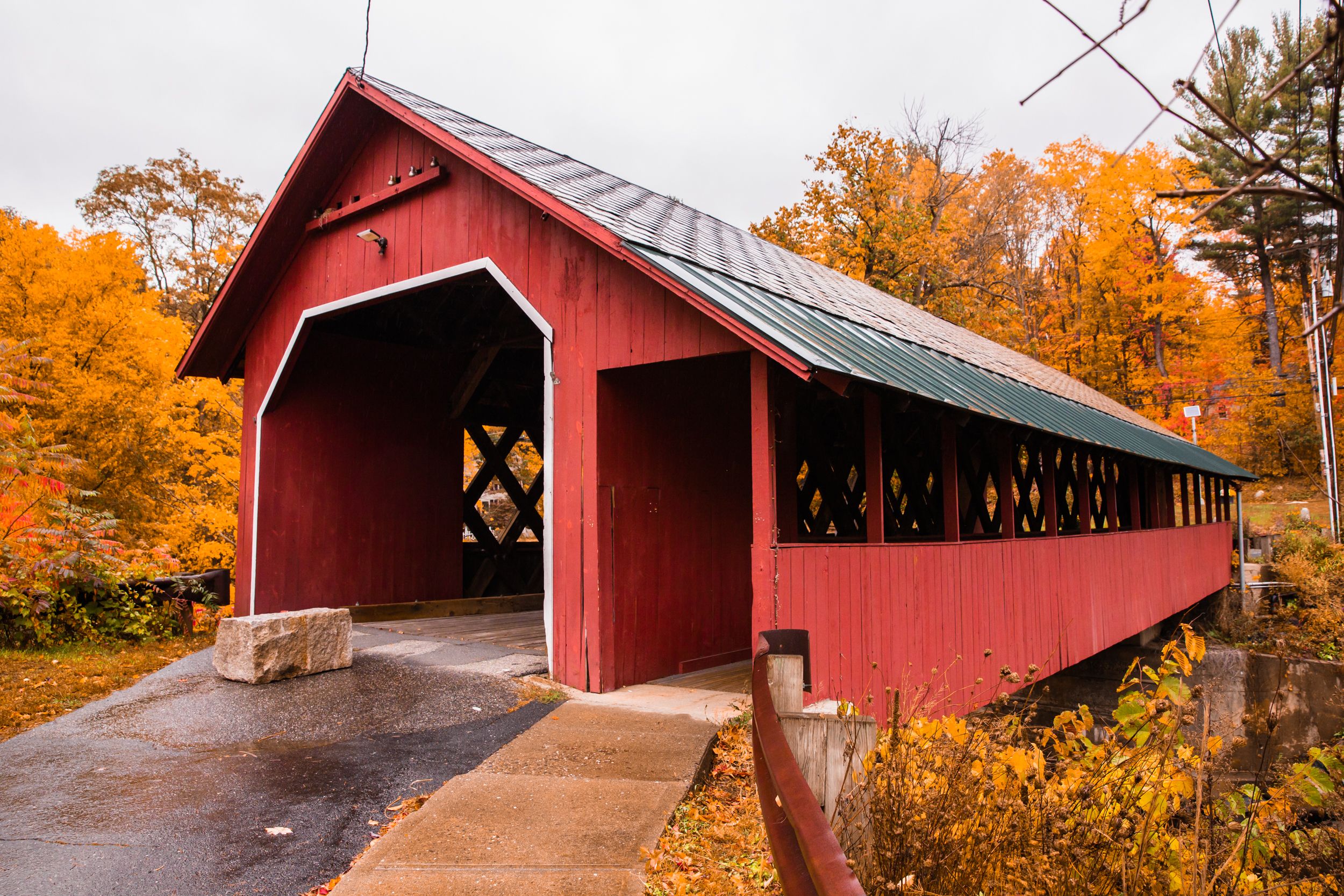 The bright red Creamery Covered Bridge at the Living Memorial Park in Brattleboro, Vermont