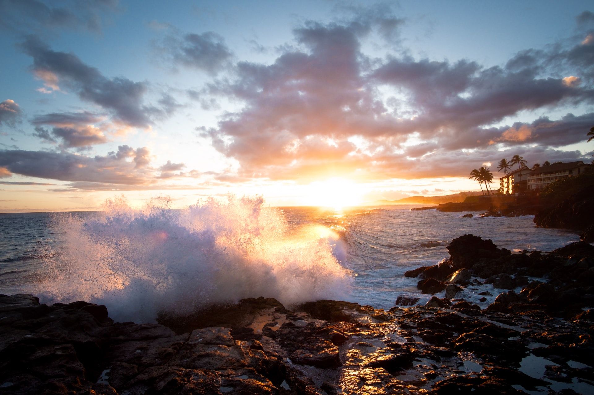 Waves crashing onto rocks in Poipu, Kauai