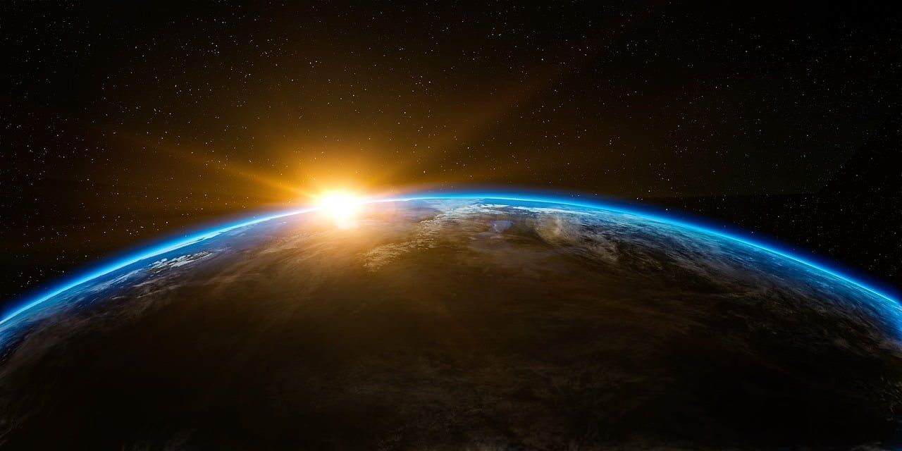 Outer space view of the earth and sun