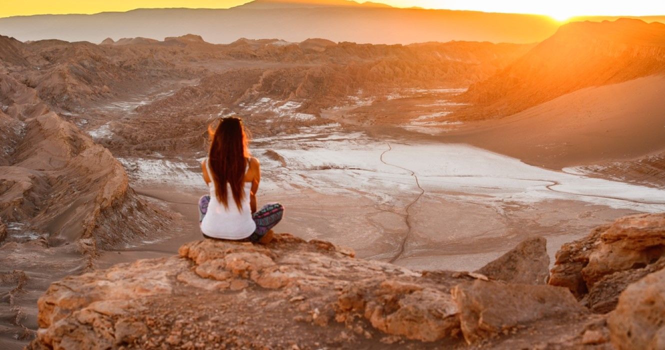 Girl sitting in the Atacama desert, Chile