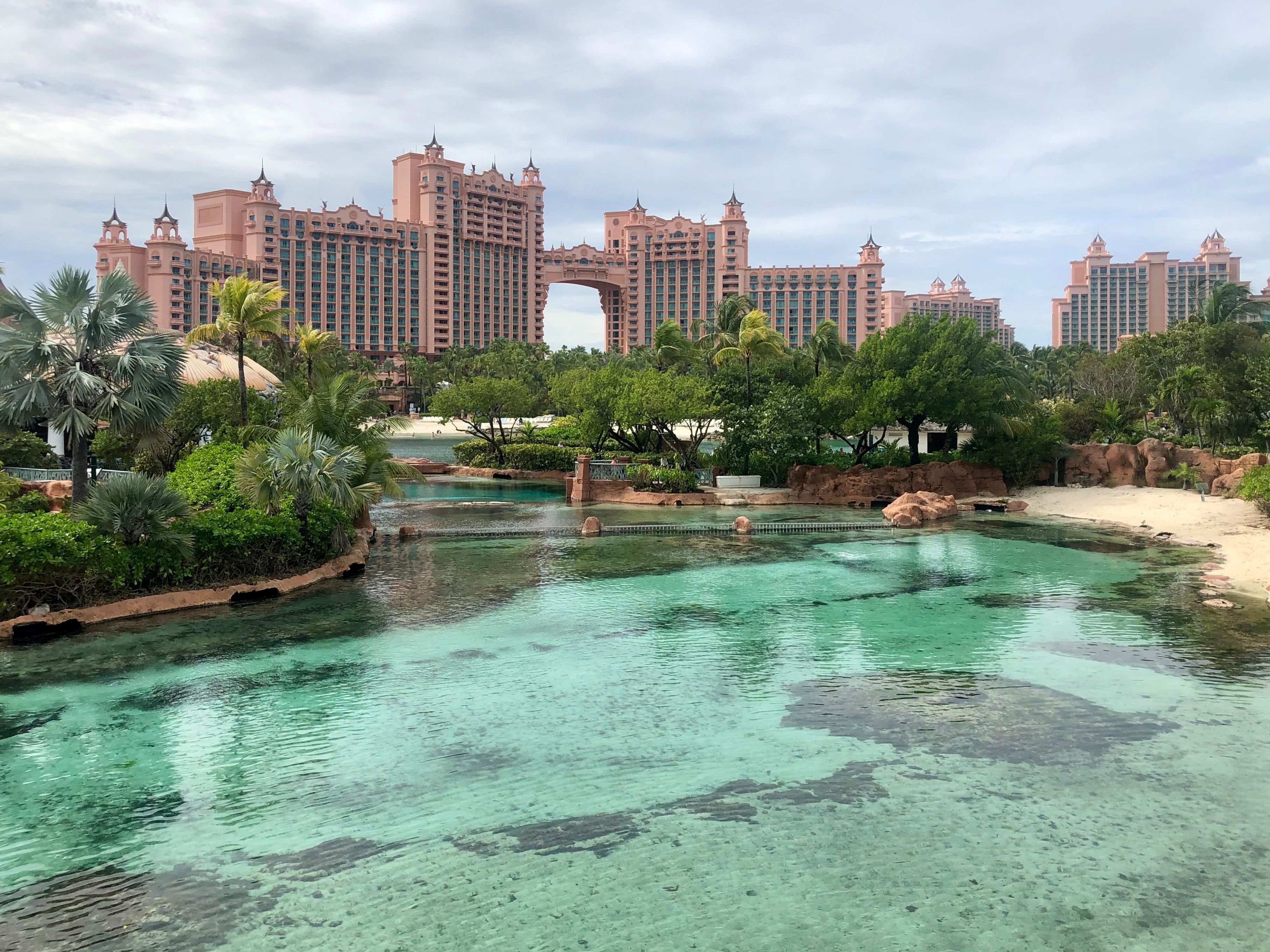 Clear, turquoise waters in Nassau, Bahamas framed by the impressive Atlantis Resort