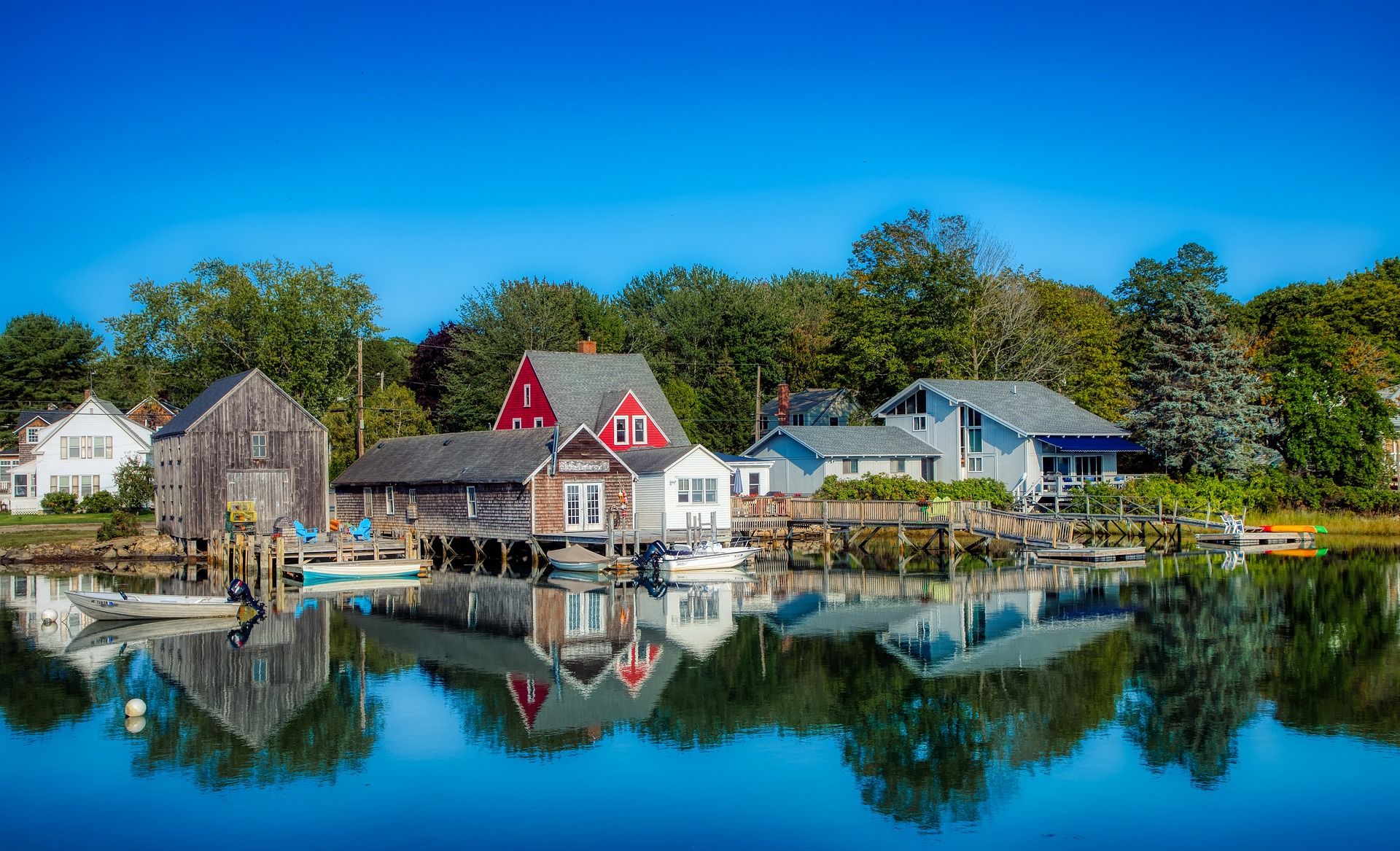 Reflection of houses on water in Cape Porpoise Harbor, Kennebunkport, Maine