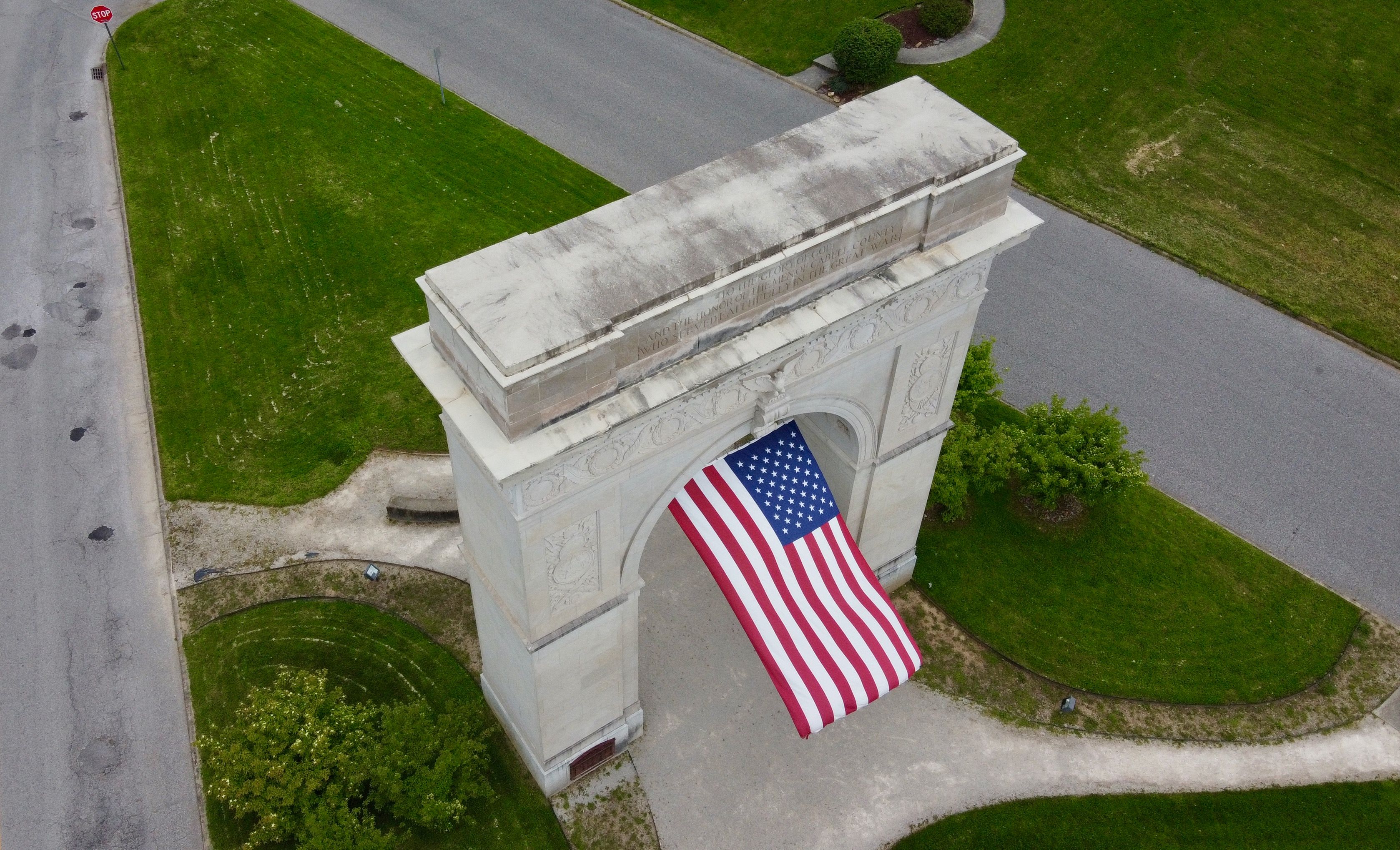 Memorial Arch in Huntington, WV with American flag
