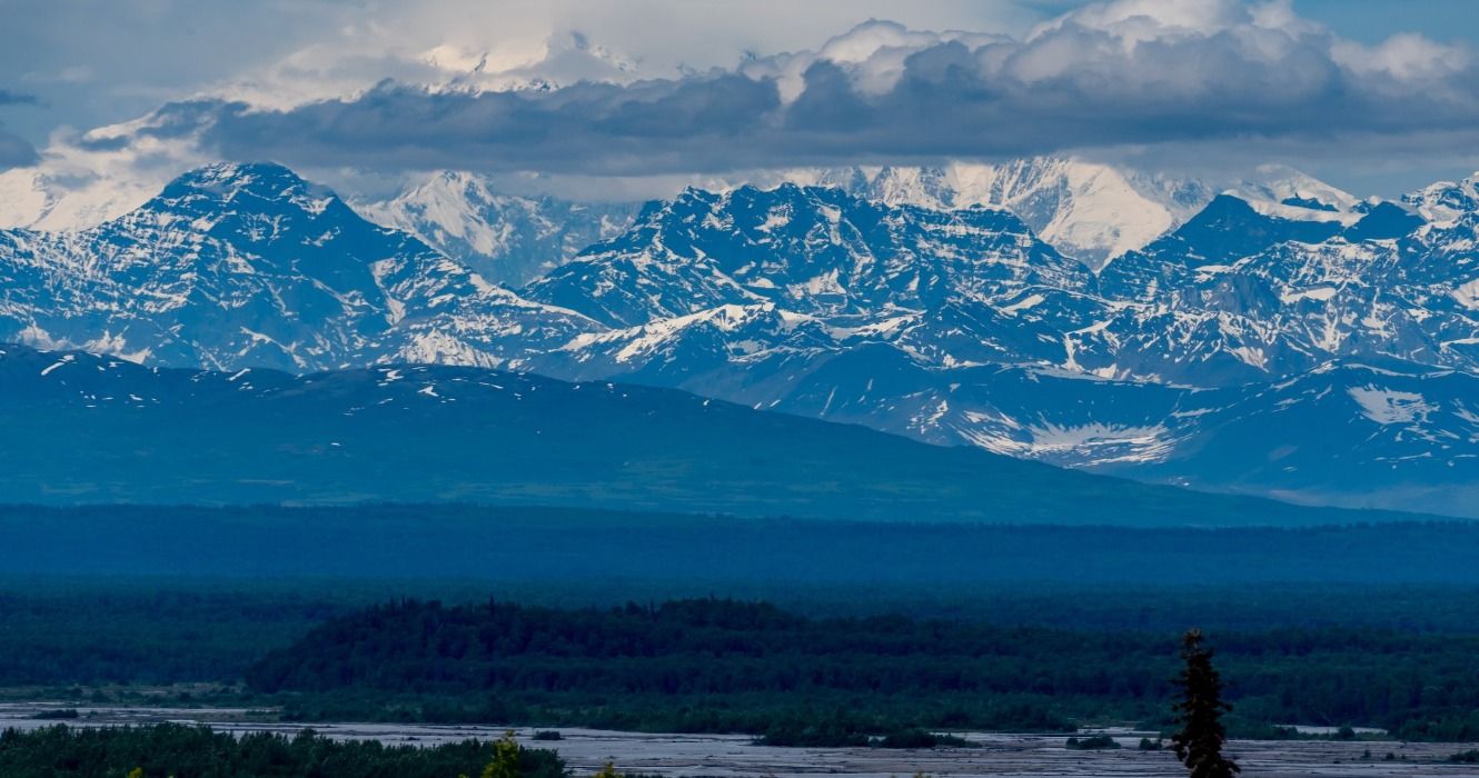 Snowy mountains, rivers, and forests in Denali, Denali National Park and Preserve, Alaska, USA