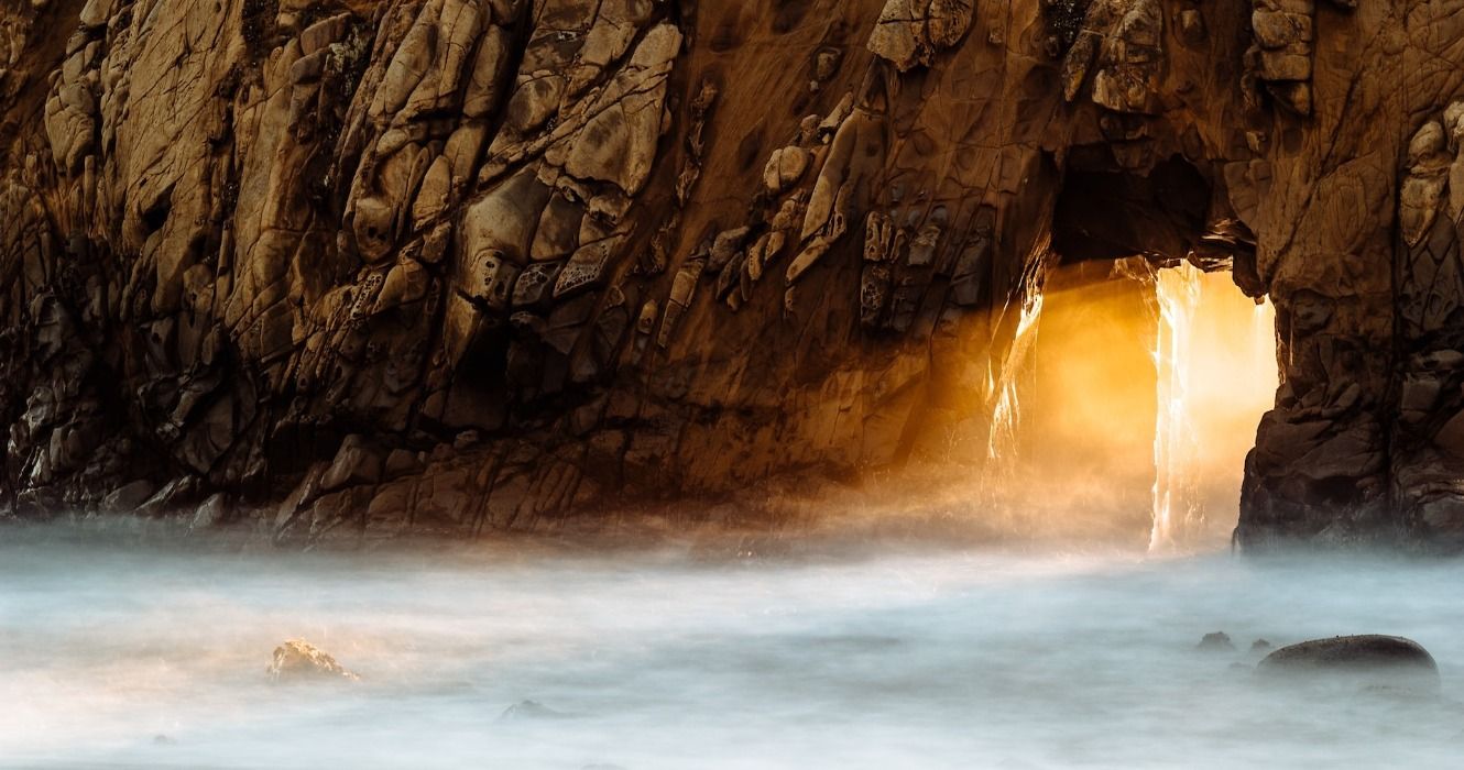 Sunset at Keyhole Arch on Pfeiffer Beach in California
