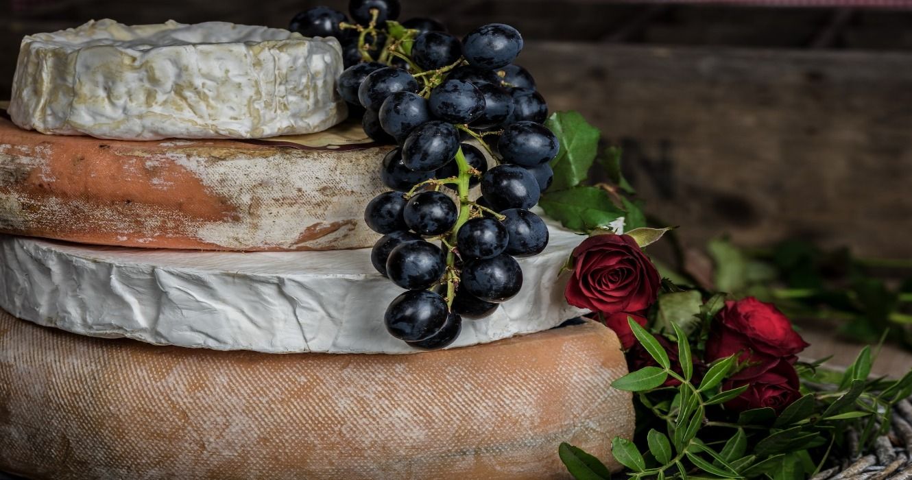 Authentic French cheeses with grapes