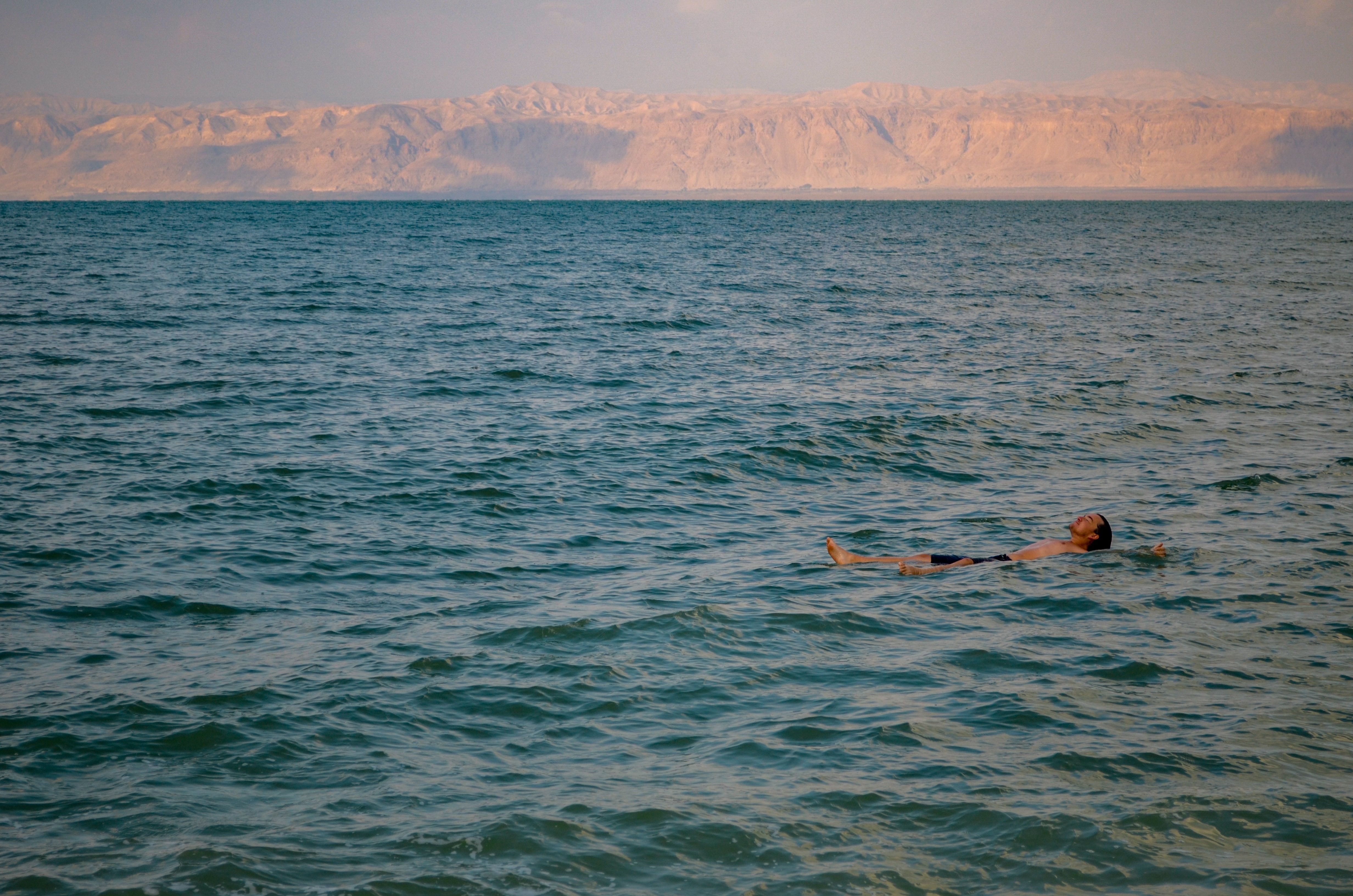 Dead Sea floating person Jordan