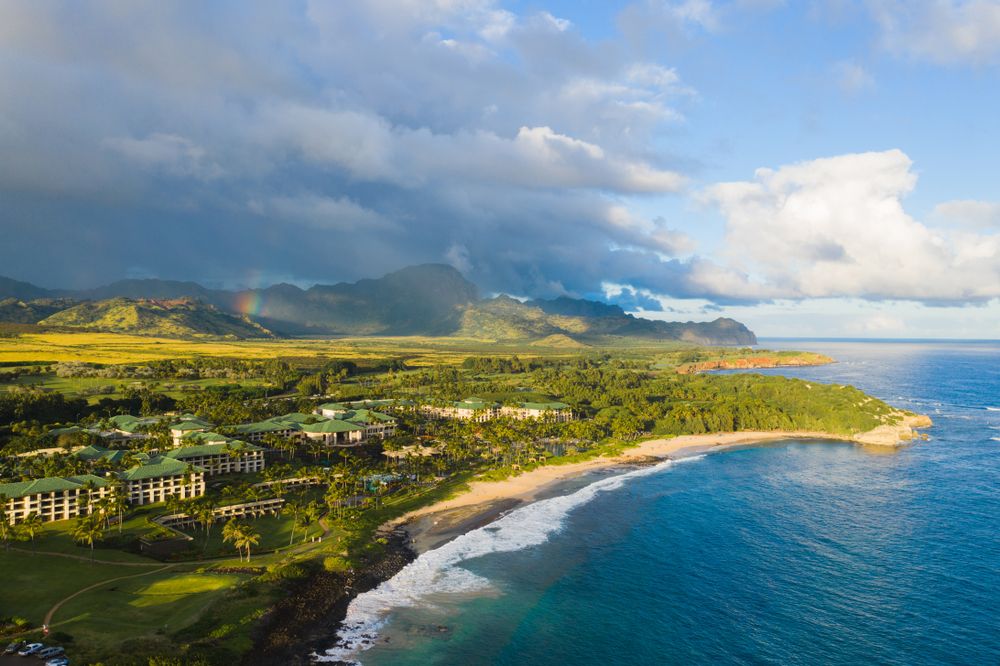 Aerial view and the ocean, a large Kauai resort, and the beautiful mountains. 