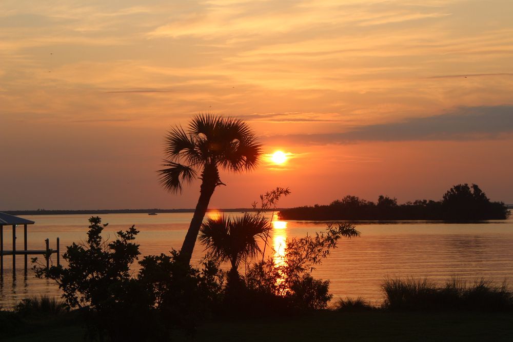 A stunning orange sunset over the Indian River Lagoon in Sebastian, Florida