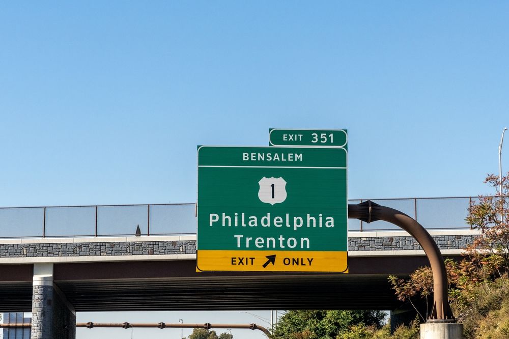 A road sign showing direction to Philadelphia and Trenton