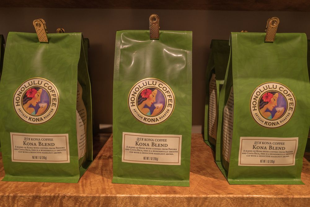 Green bags of Kona Blend Coffee from Honolulu Coffee 
