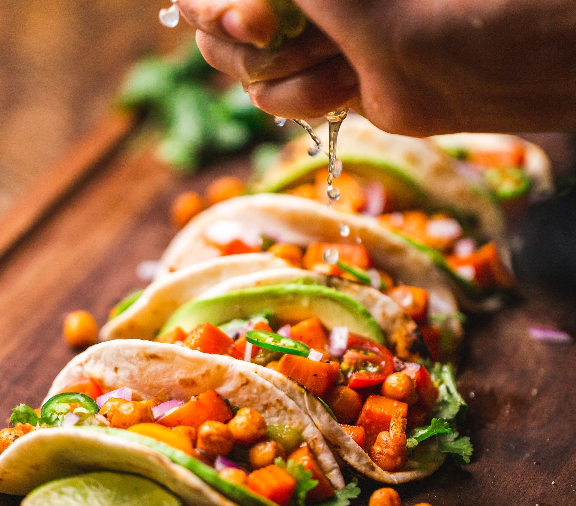 tacos with limes on table