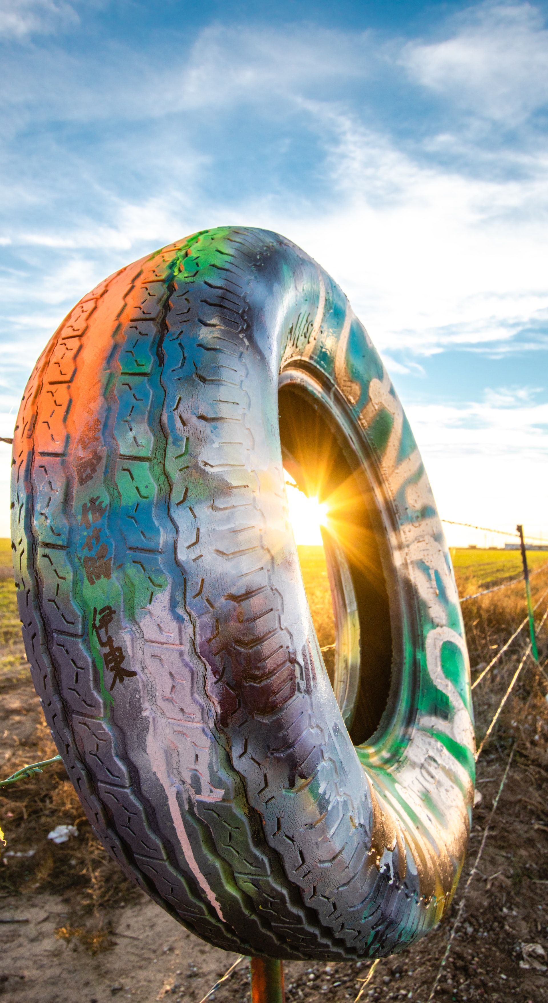 A tyre covered in graffiti art, a quirky roadside attraction in the US