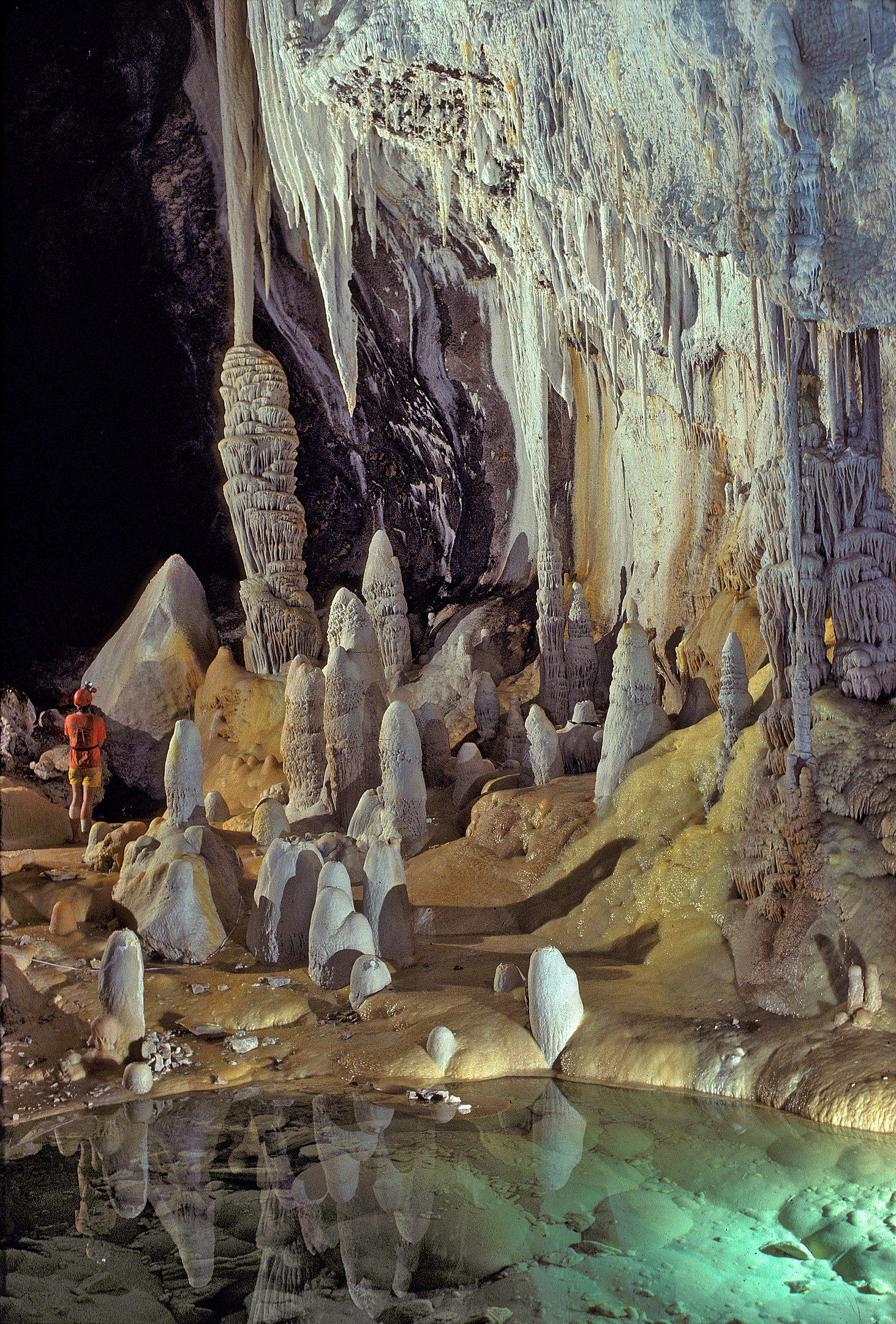 Stalagmites, stalactites, and draperies by a pool in Lechuguilla Cave in New Mexico, USA