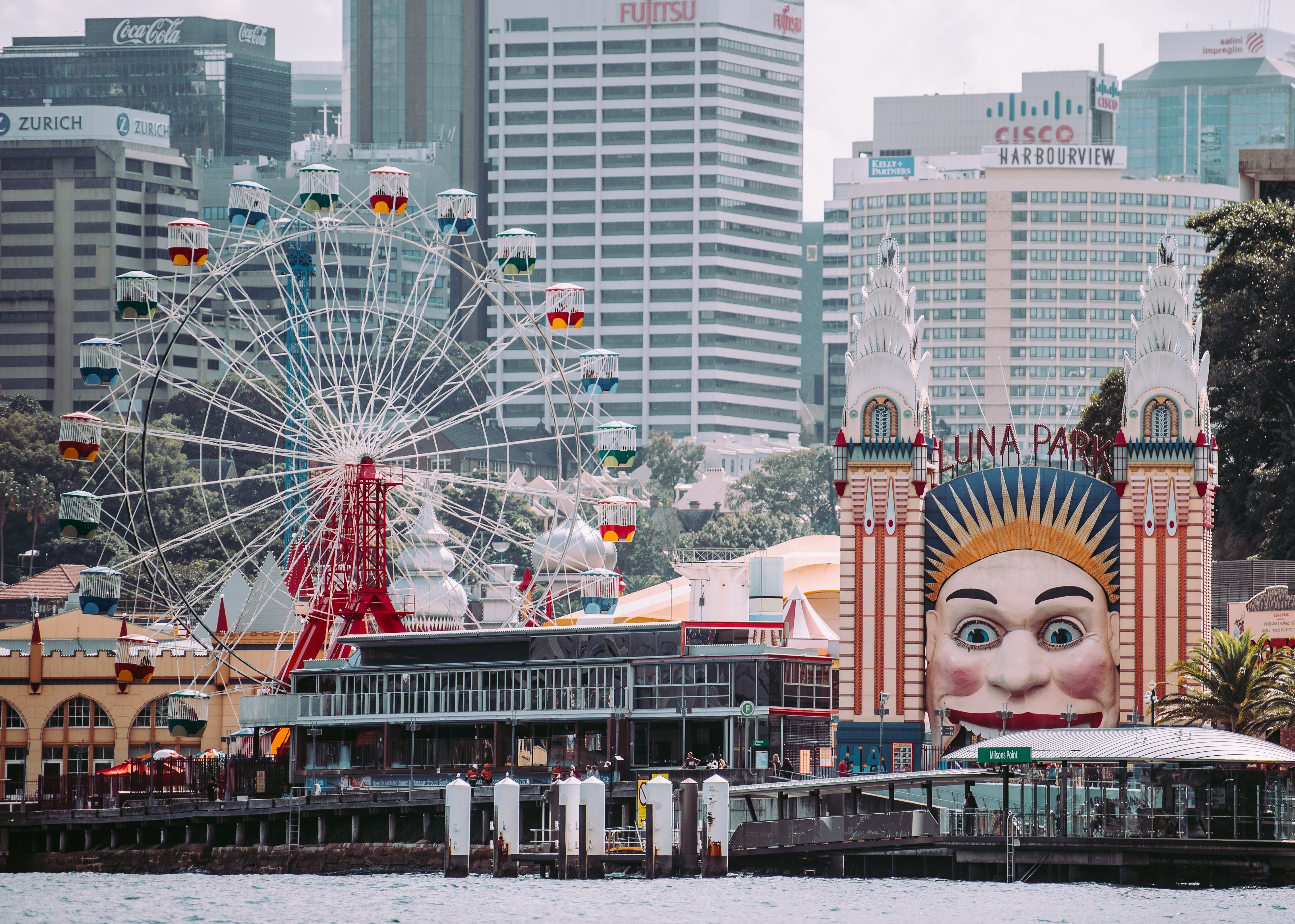 Ferris wheel and the huge smiling face of a moon at the entrance of Luna Park, Sydney