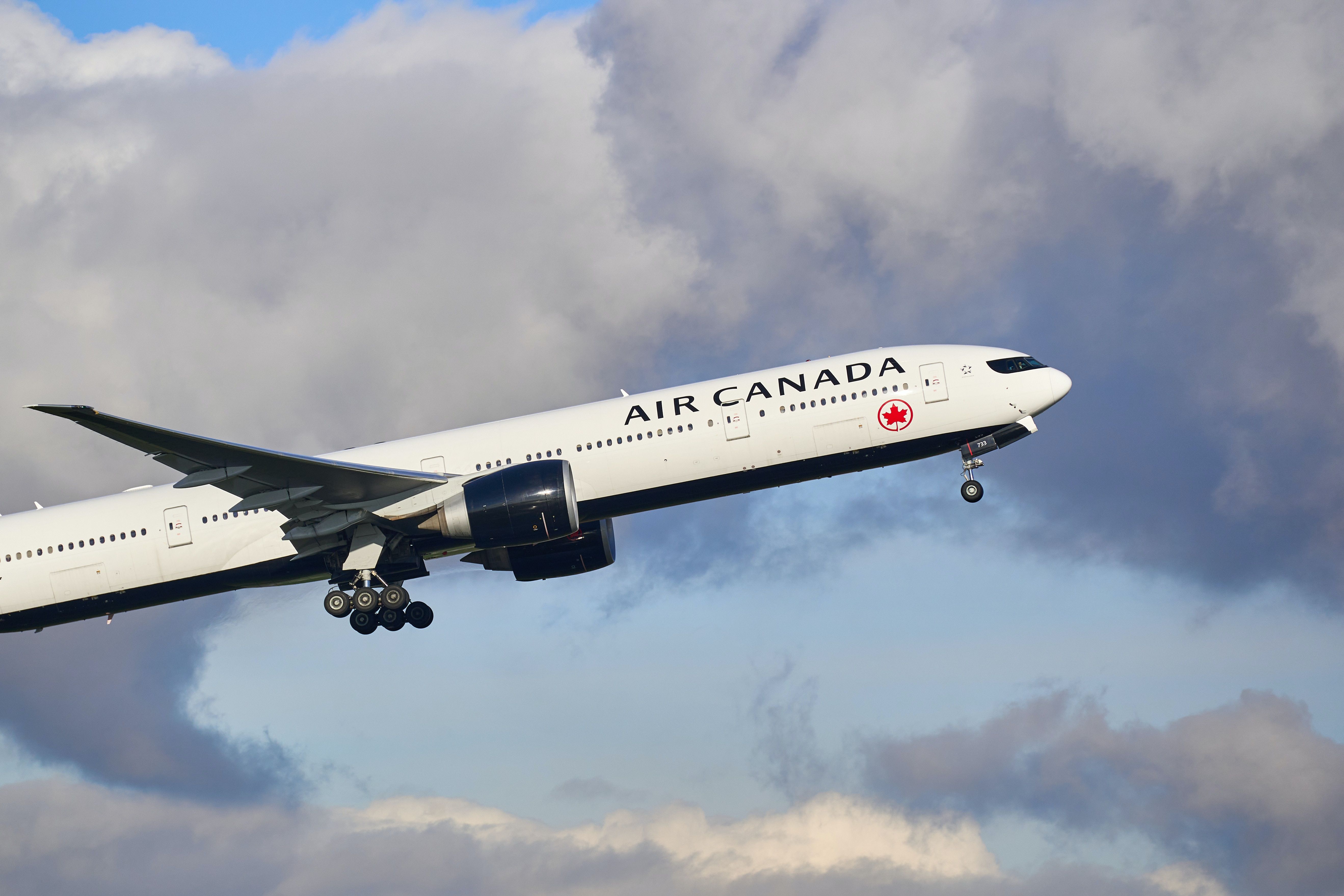 Air Canada aircraft, white with red logo, airborne 