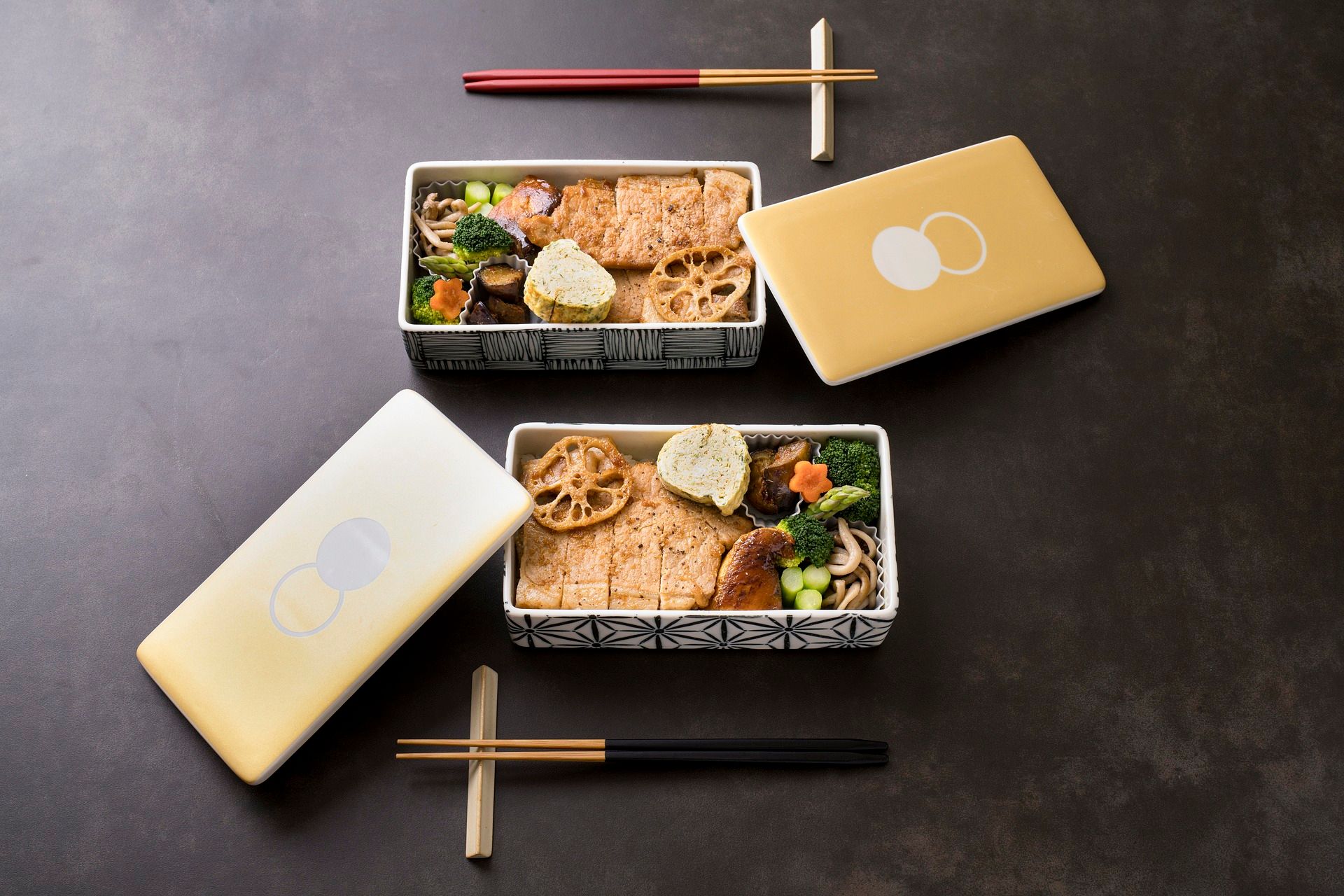 Two bento boxes with chopsticks
