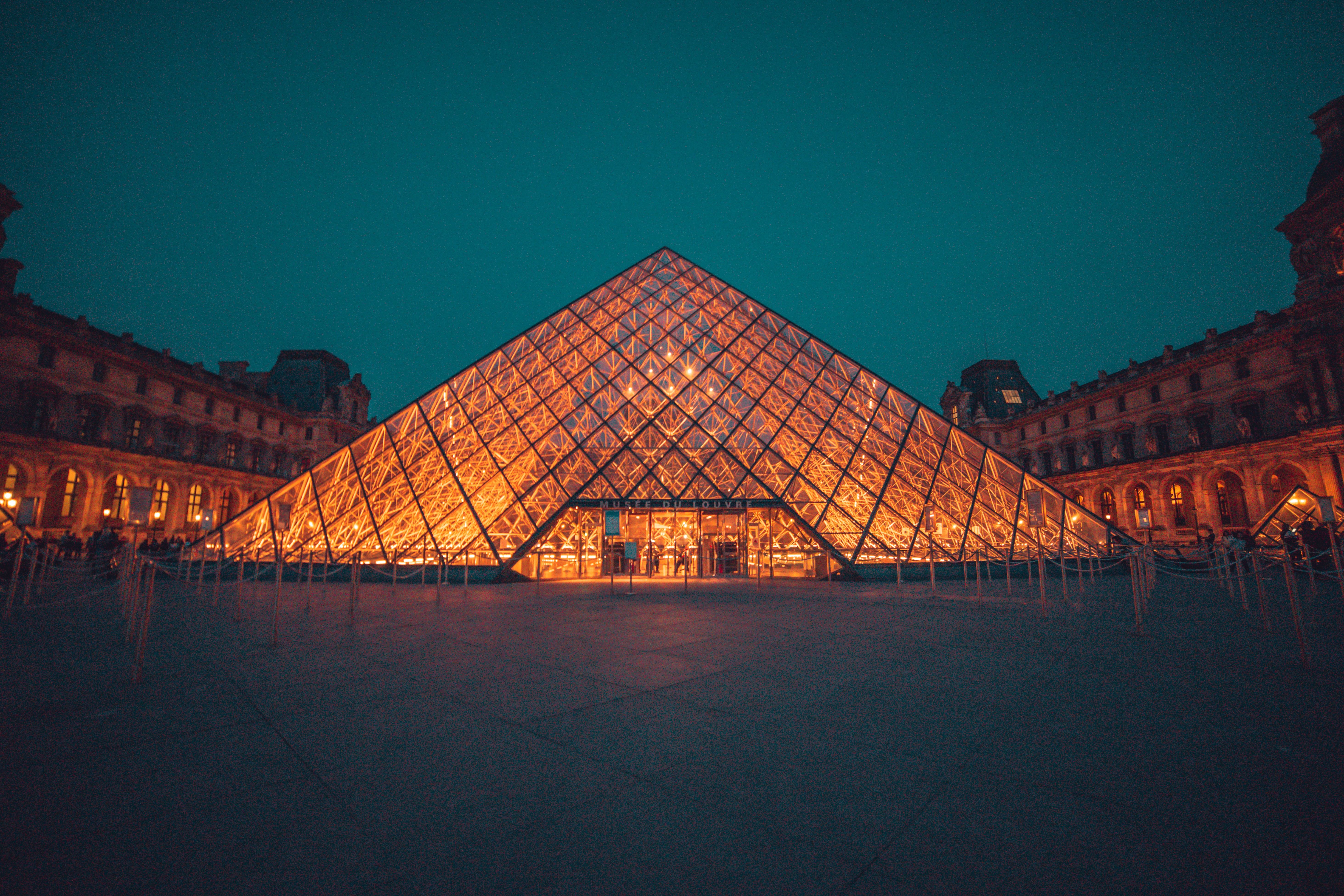 The Louvre Museum Pyramid at night in Paris, France