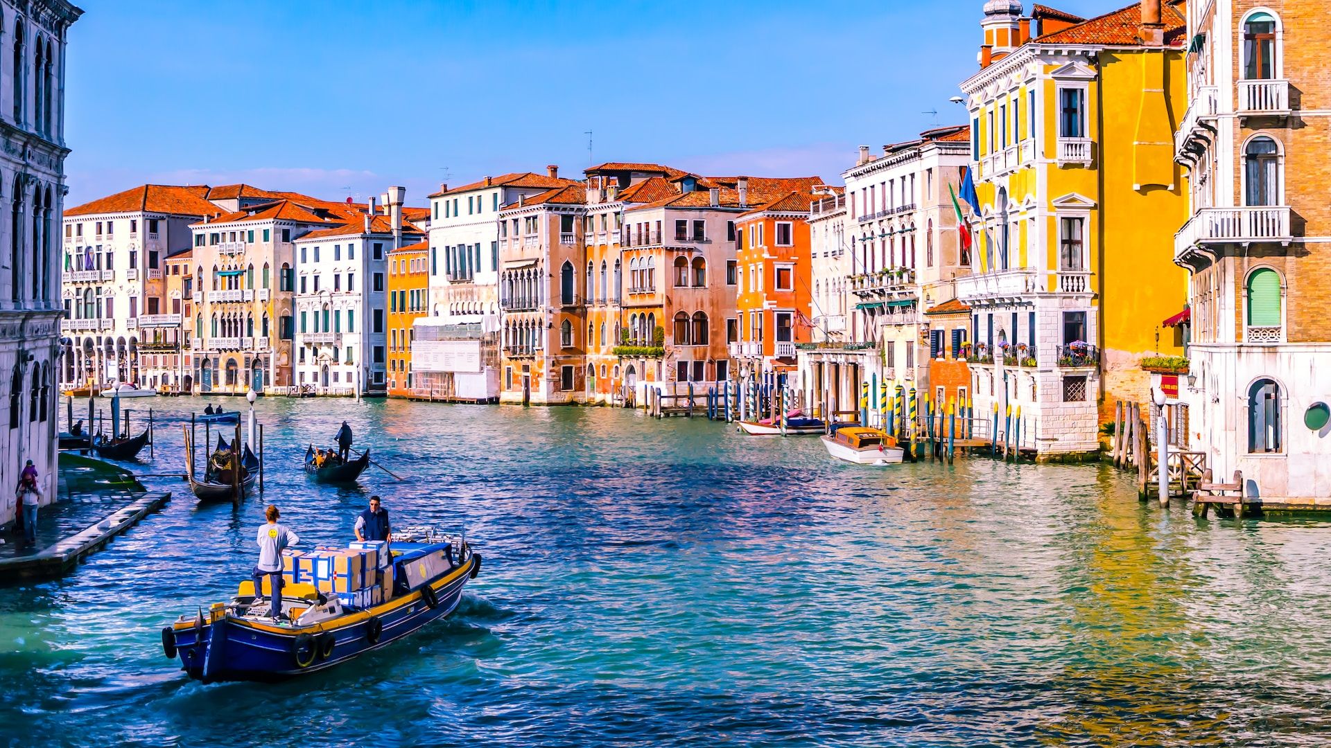 Bright days and colorful houses on a peaceful canal in Venice