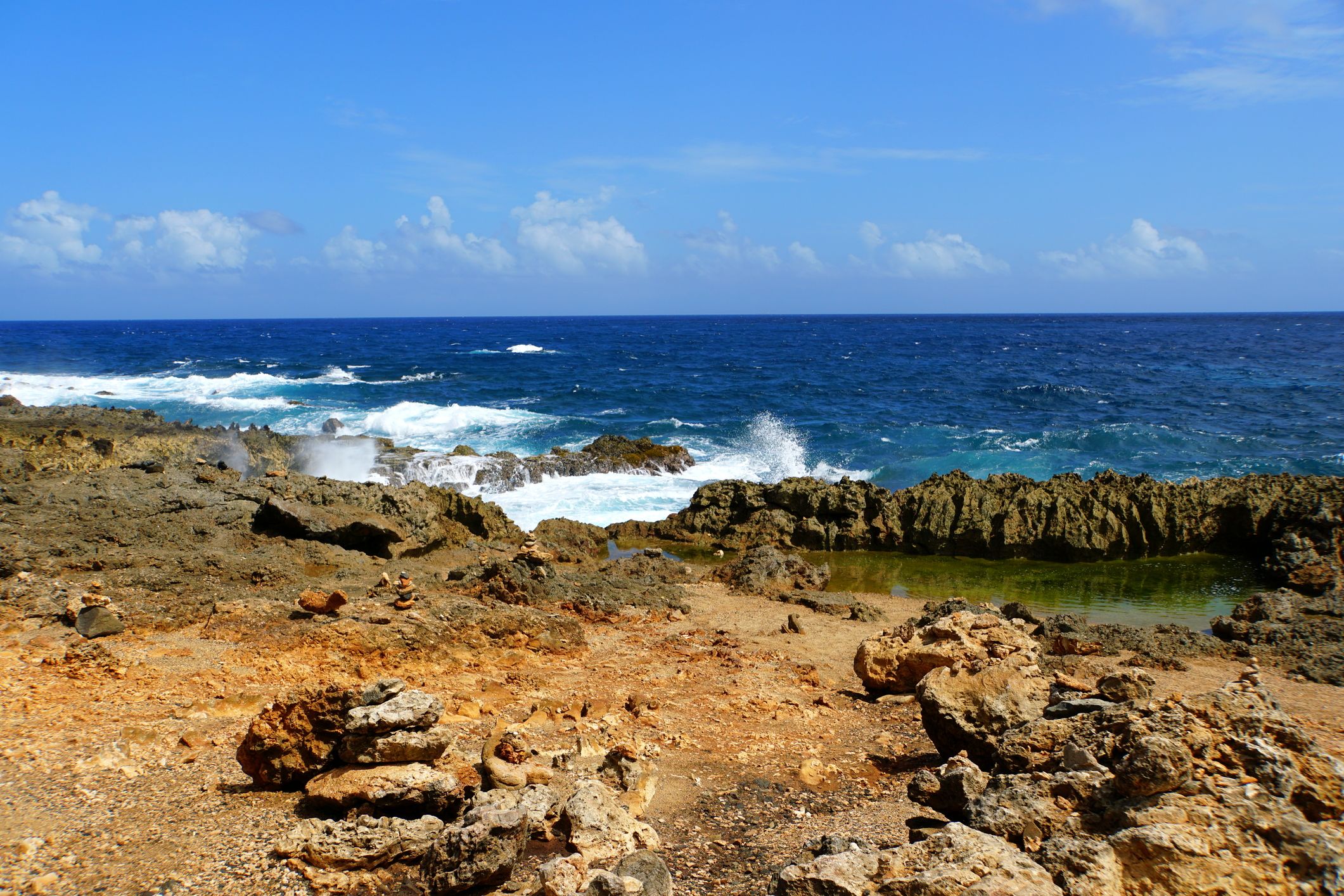  Rocky cliffs with rough waves at Andicuri Beach, Aruba